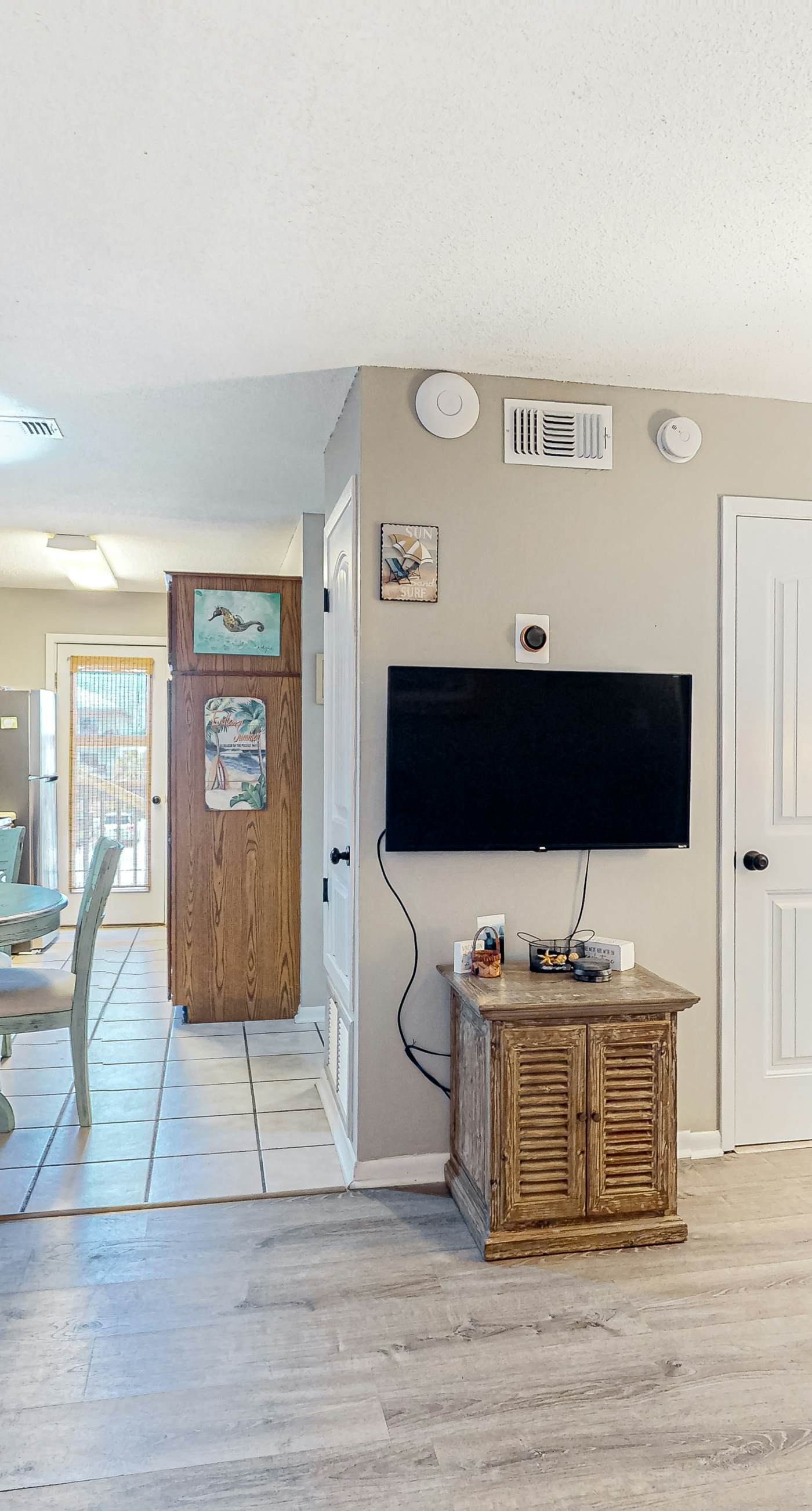 First-floor dog-friendly condo with on-site pool, beach access, & balcony