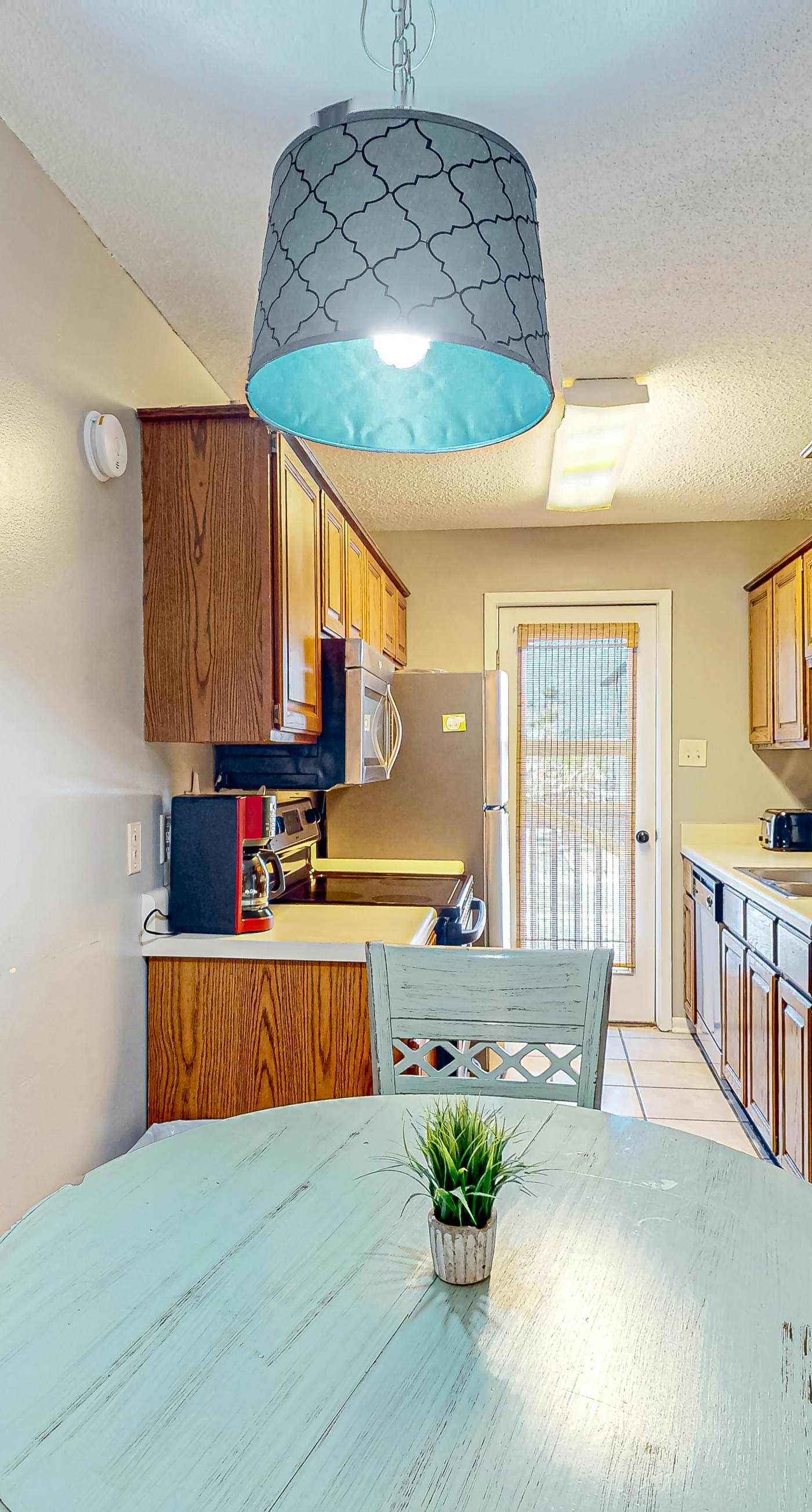 First-floor dog-friendly condo with on-site pool, beach access, & balcony