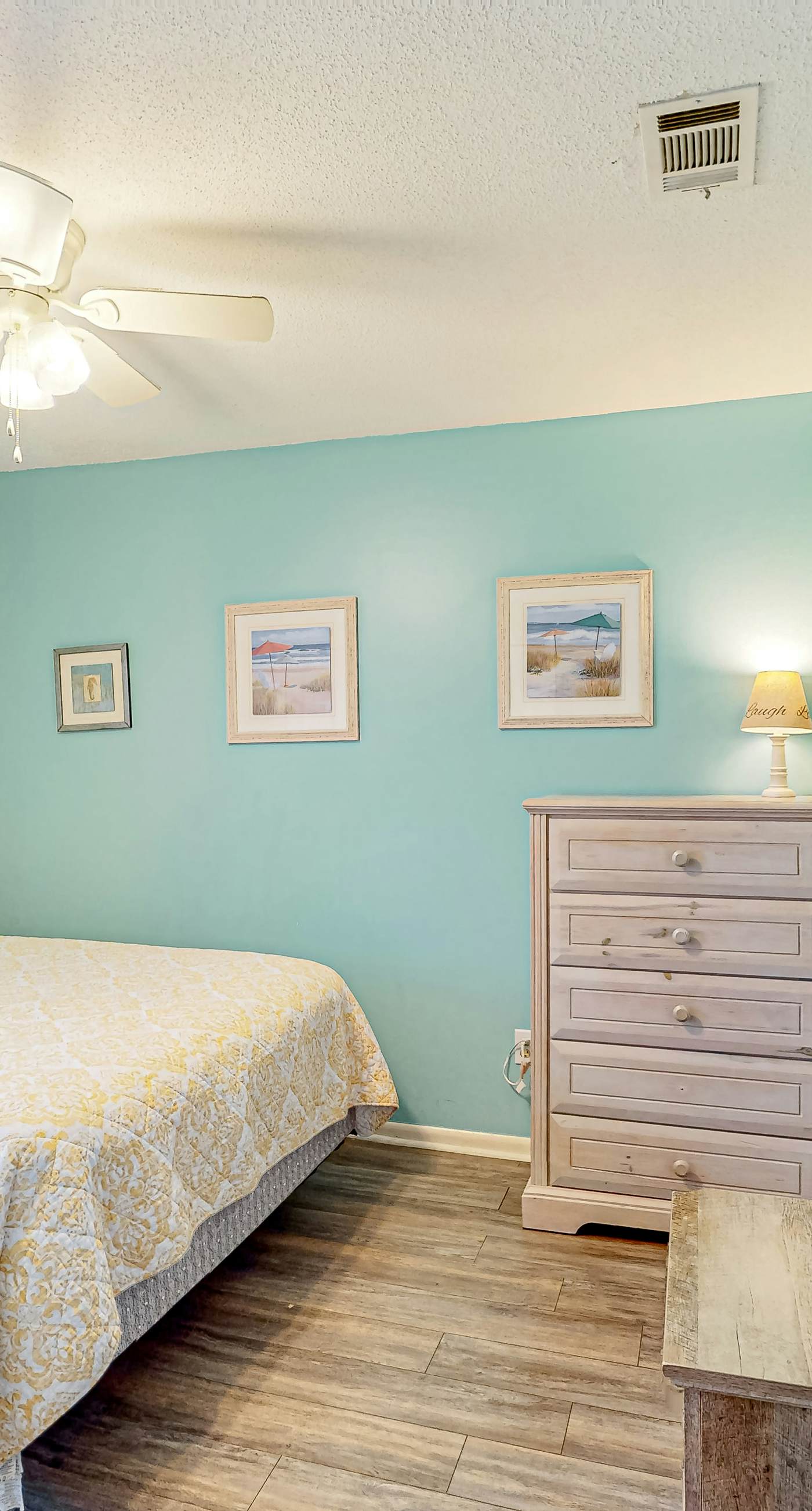 First-floor dog-friendly condo with on-site pool, beach access, & balcony