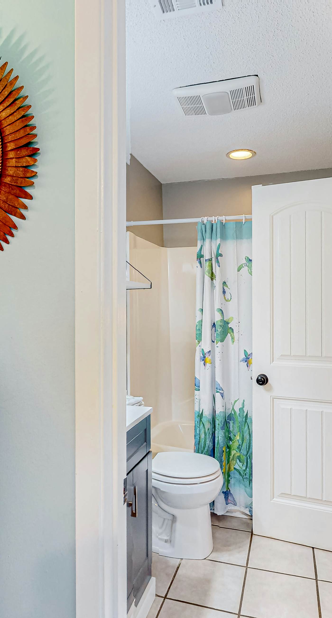 First-floor dog-friendly condo with on-site pool, beach access, & balcony