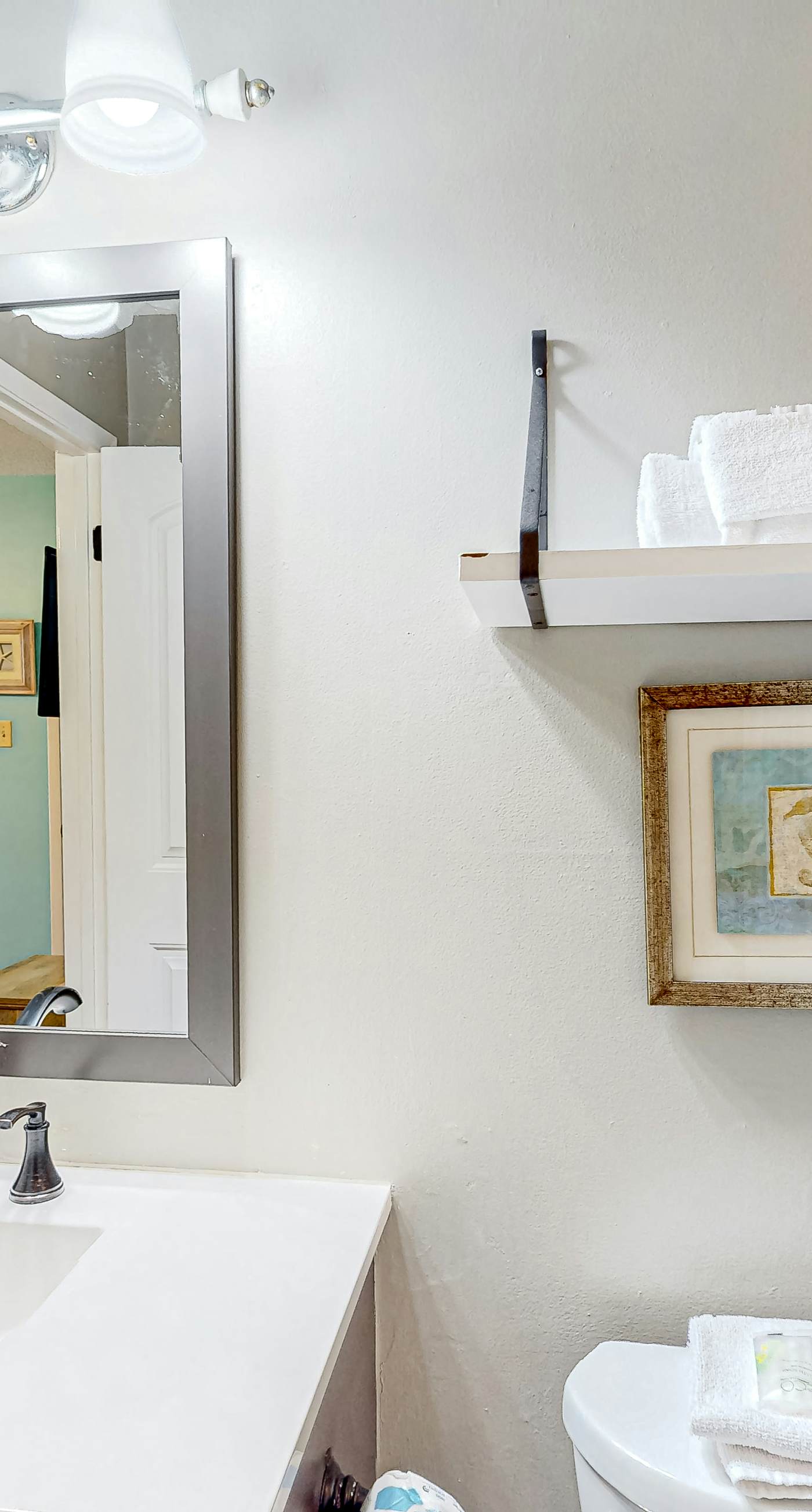 First-floor dog-friendly condo with on-site pool, beach access, & balcony