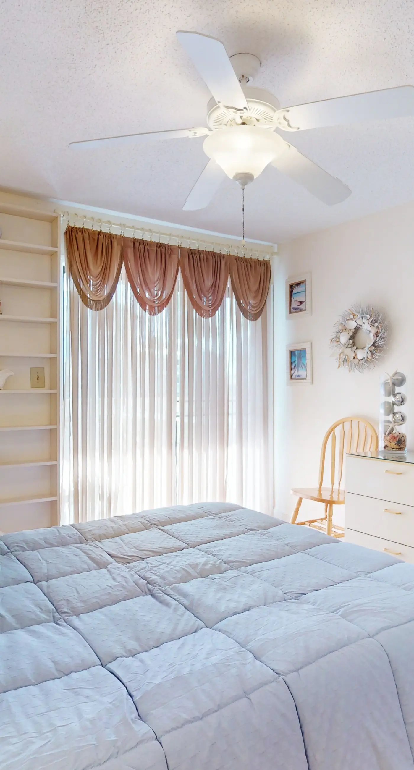Beach-themed condo with shared pool, pier, and beach access