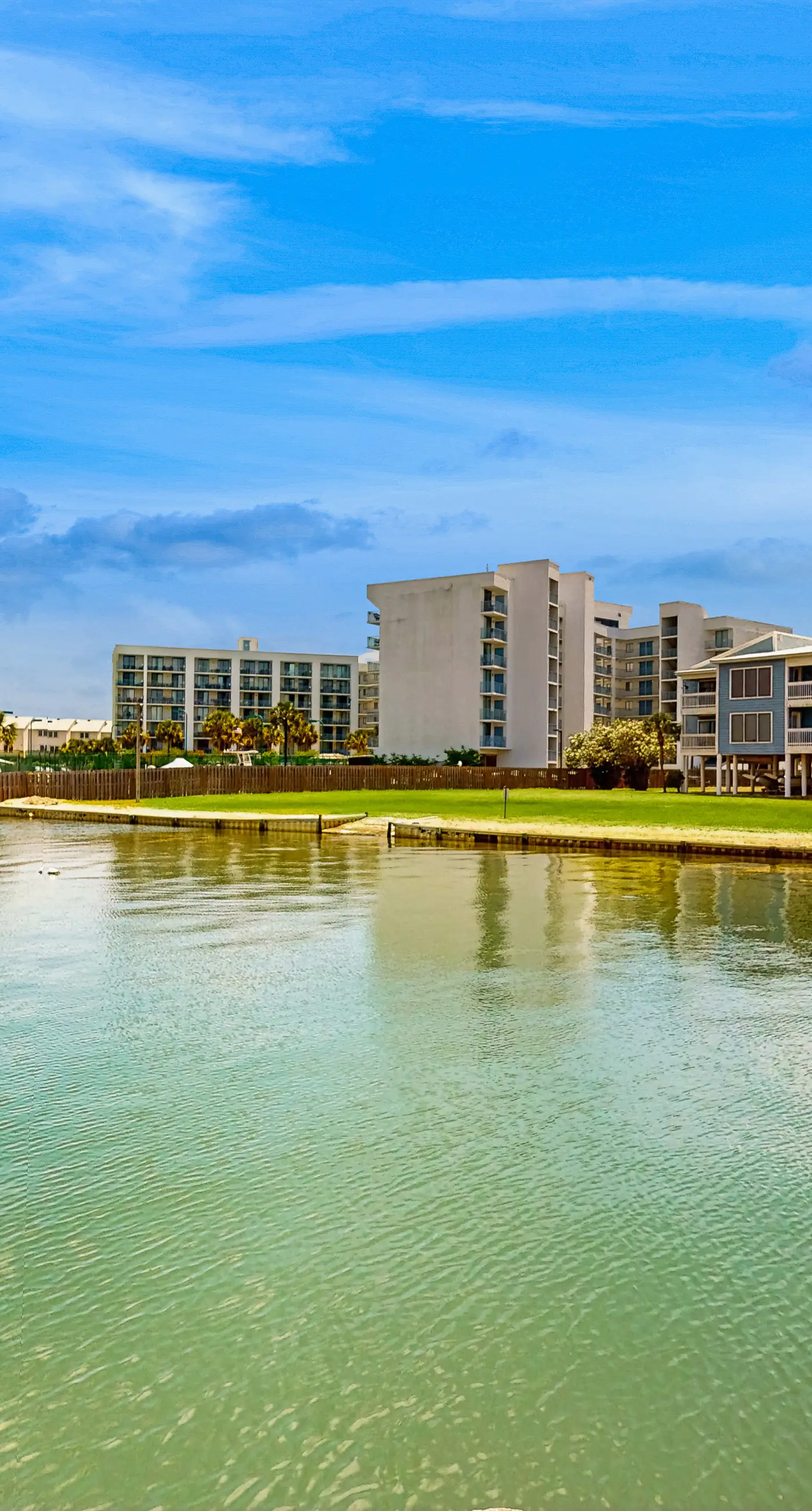 Beach-themed condo with shared pool, pier, and beach access