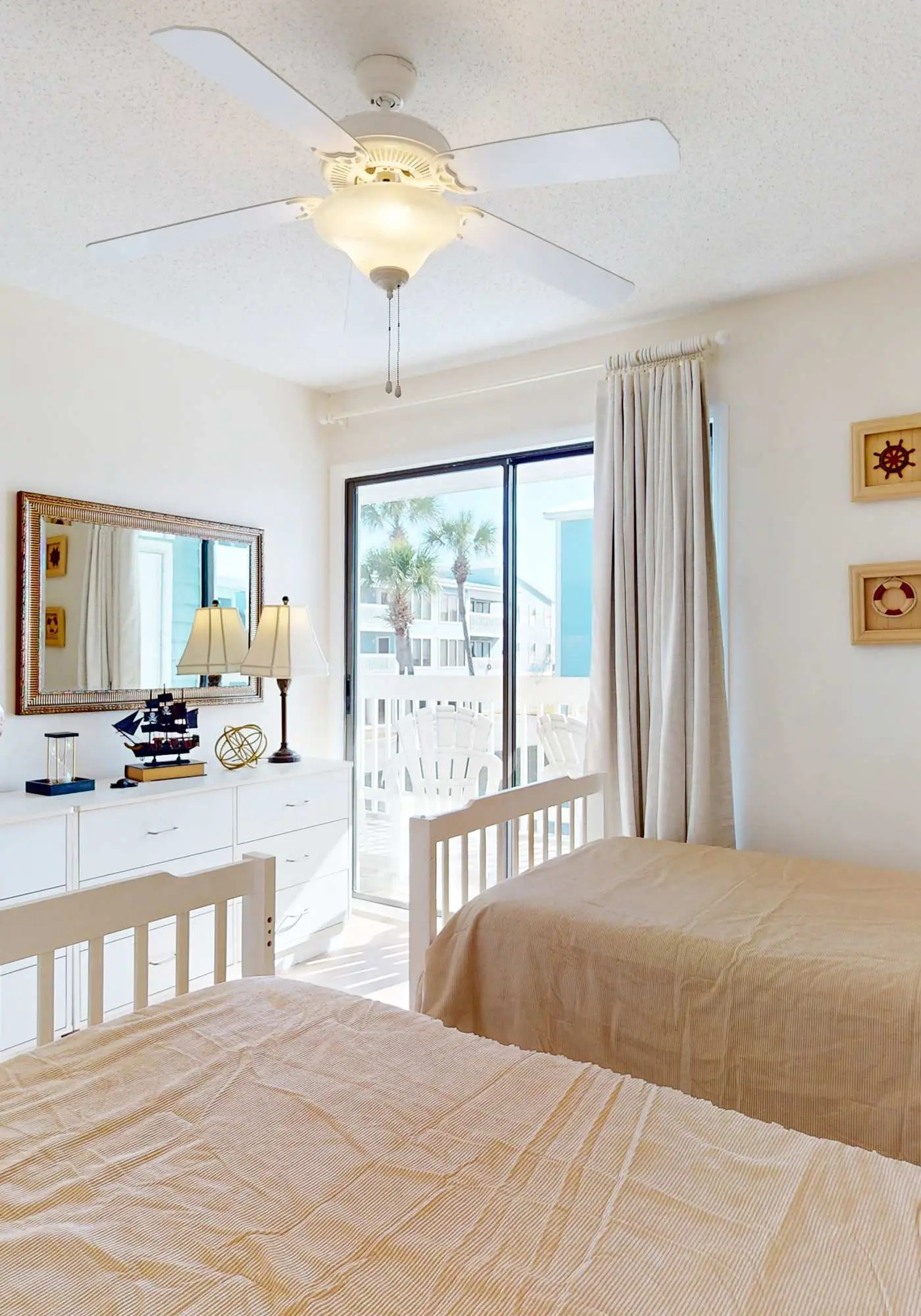 Beach-themed condo with shared pool, pier, and beach access