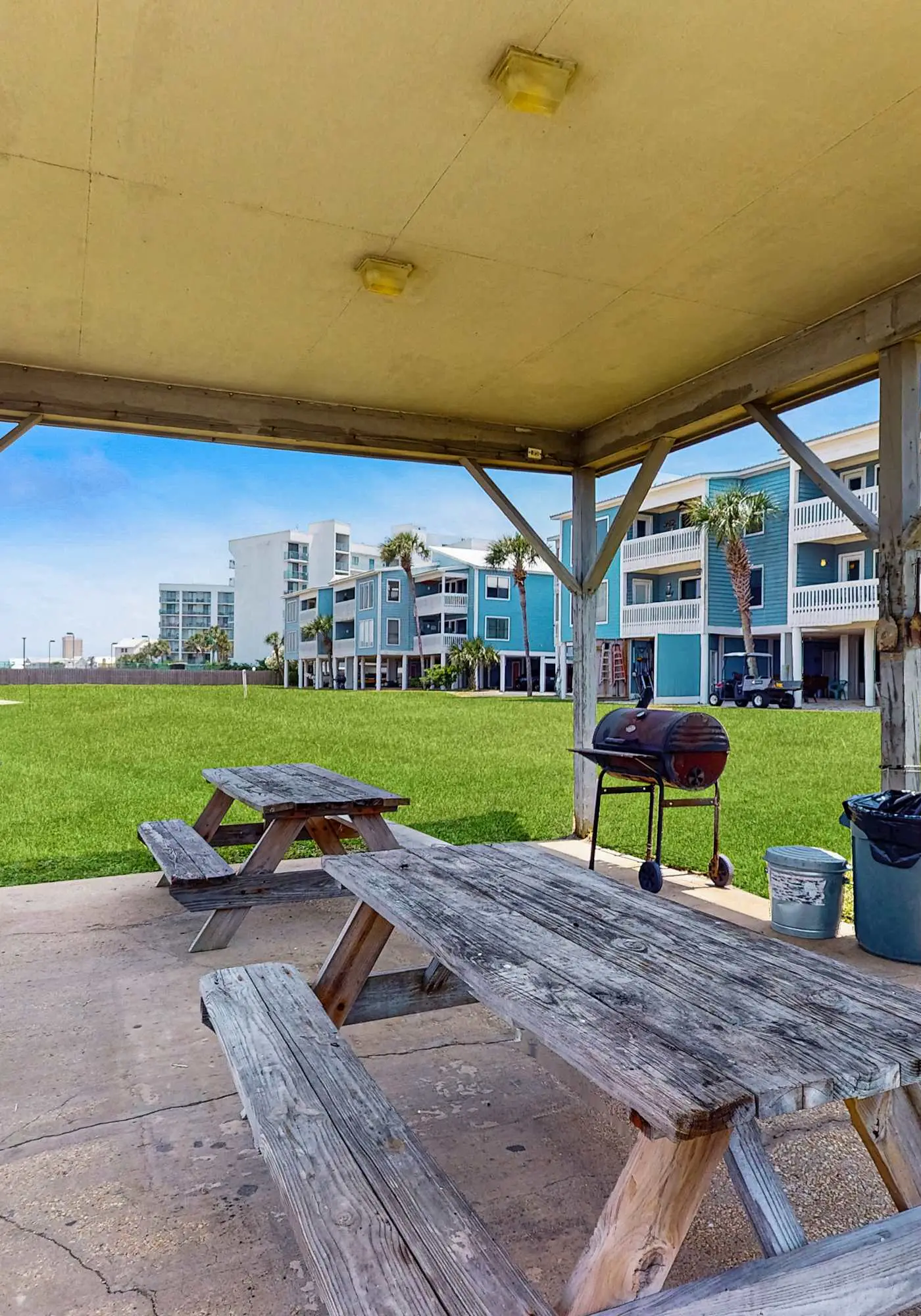 Beach-themed condo with shared pool, pier, and beach access