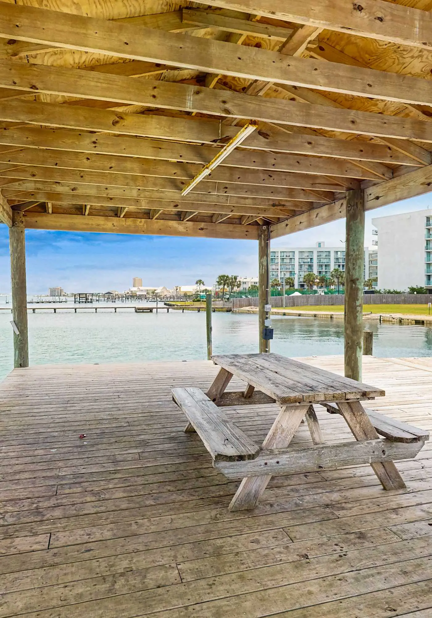 Beach-themed condo with shared pool, pier, and beach access