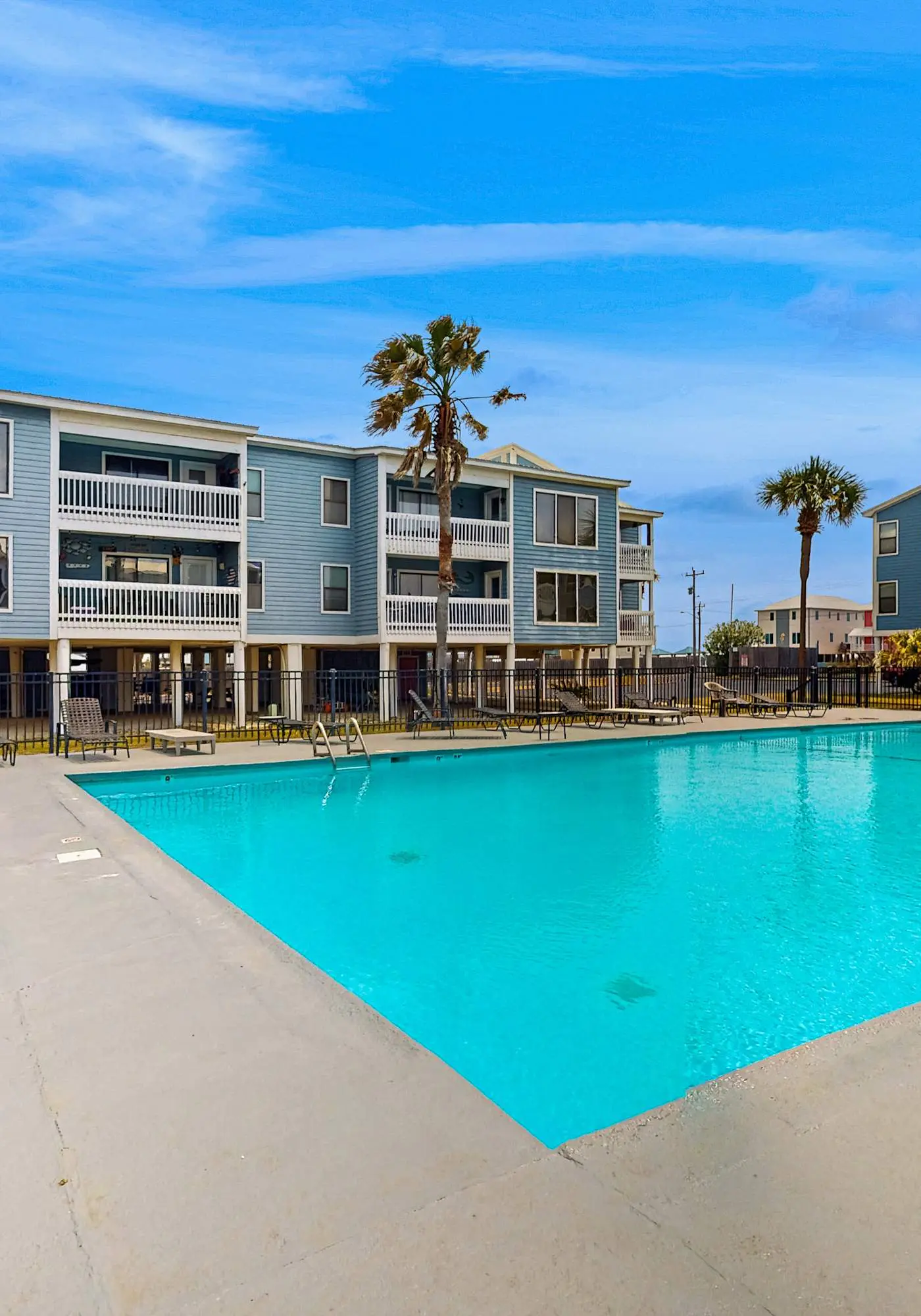 Beach-themed condo with shared pool, pier, and beach access