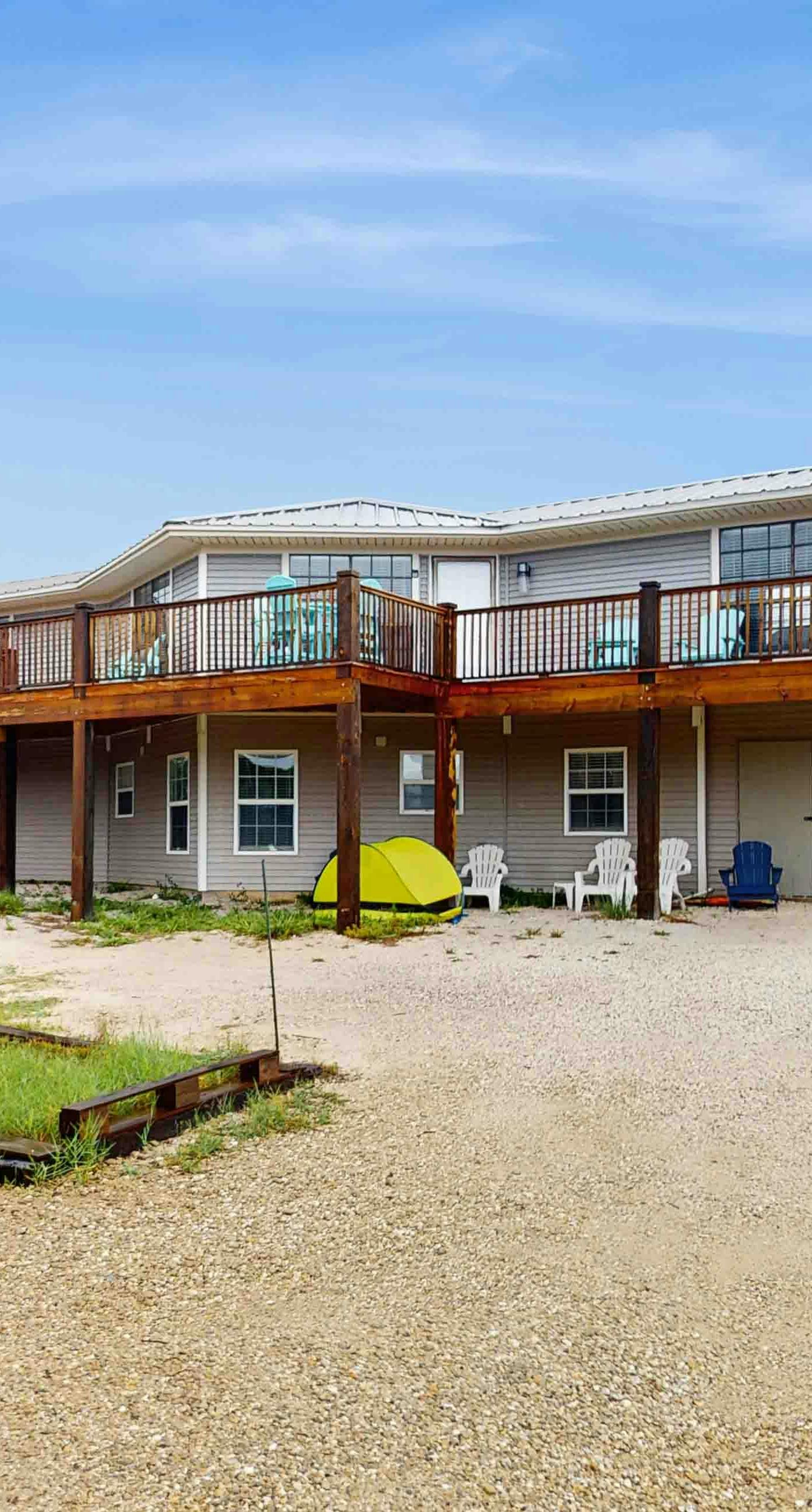 Upstairs duplex near the beach with deck, outdoor shower, W/D, streaming, & AC