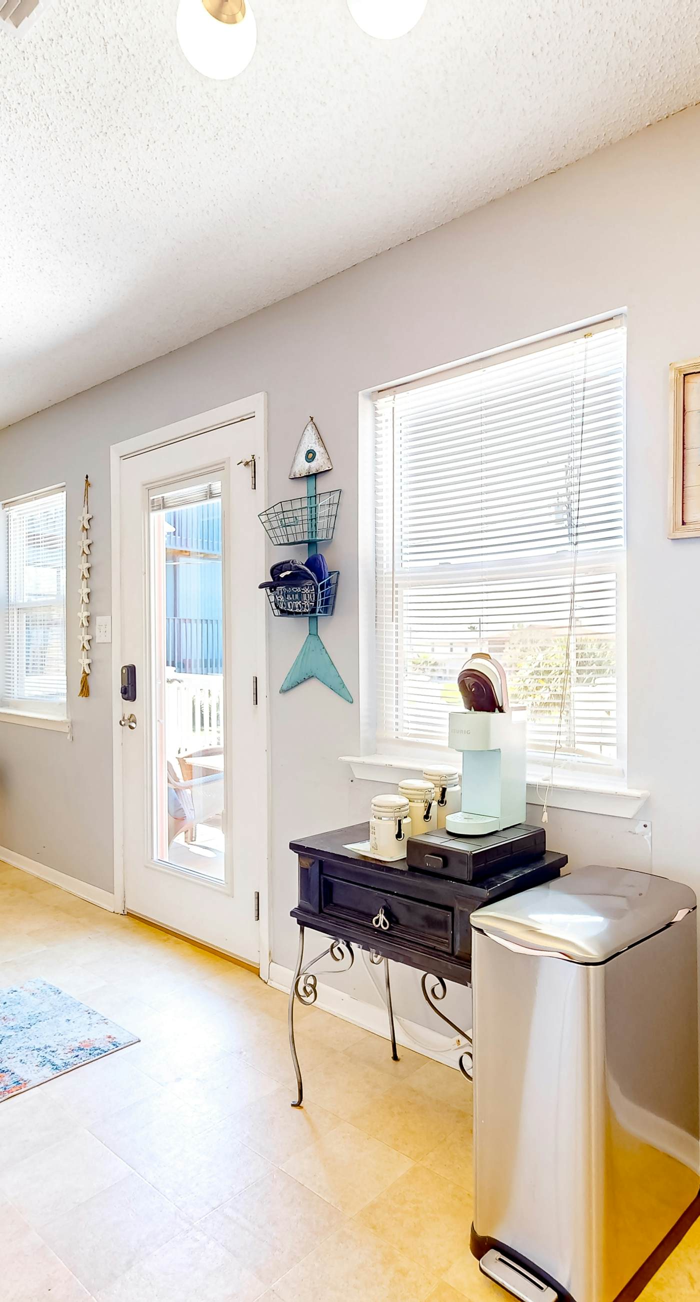 Dog-friendly duplex with a full kitchen, furnished deck, beach gear, & AC