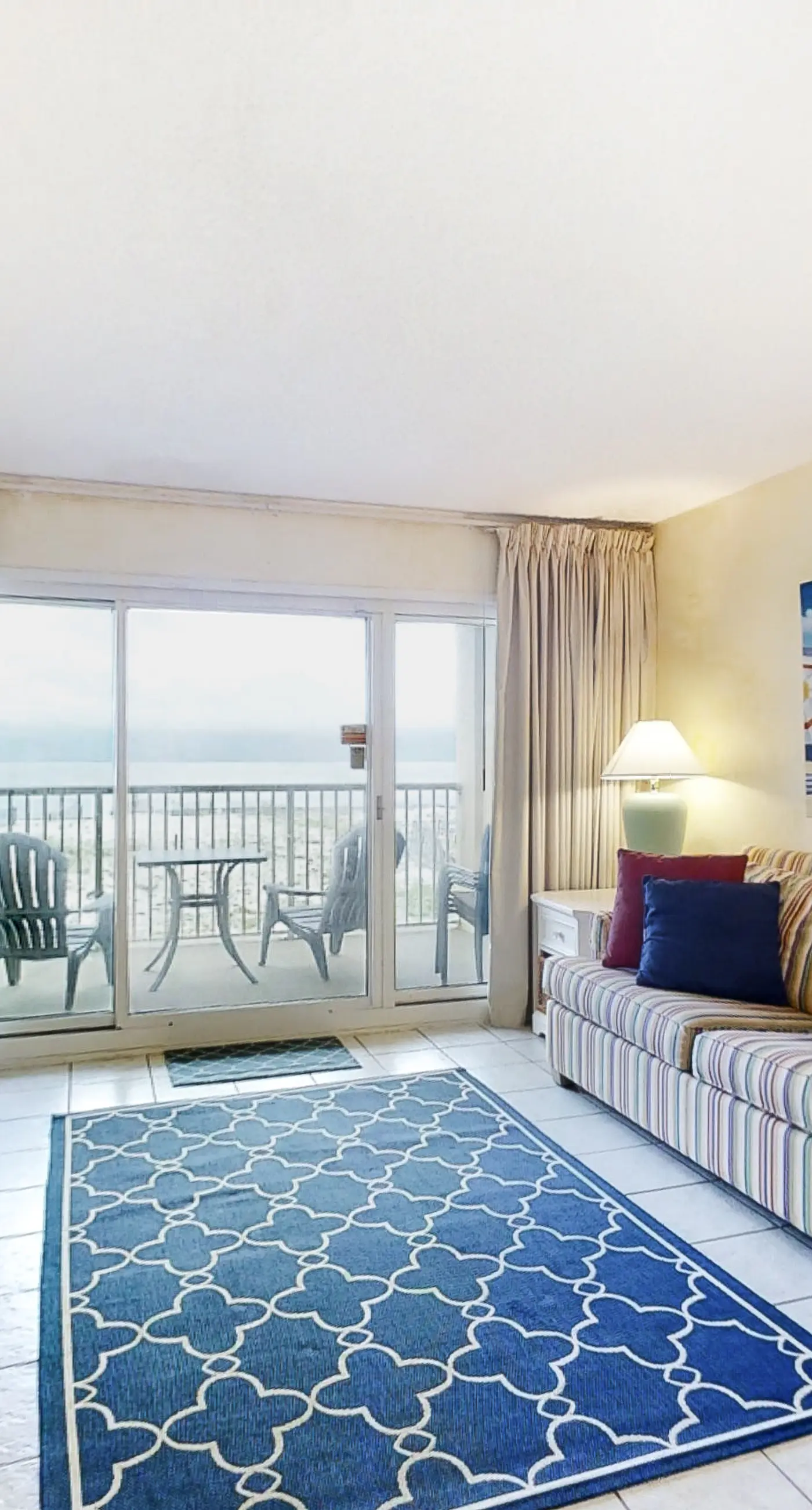 Sunny gulf-front condo with private balcony, shared outdoor pool, great views