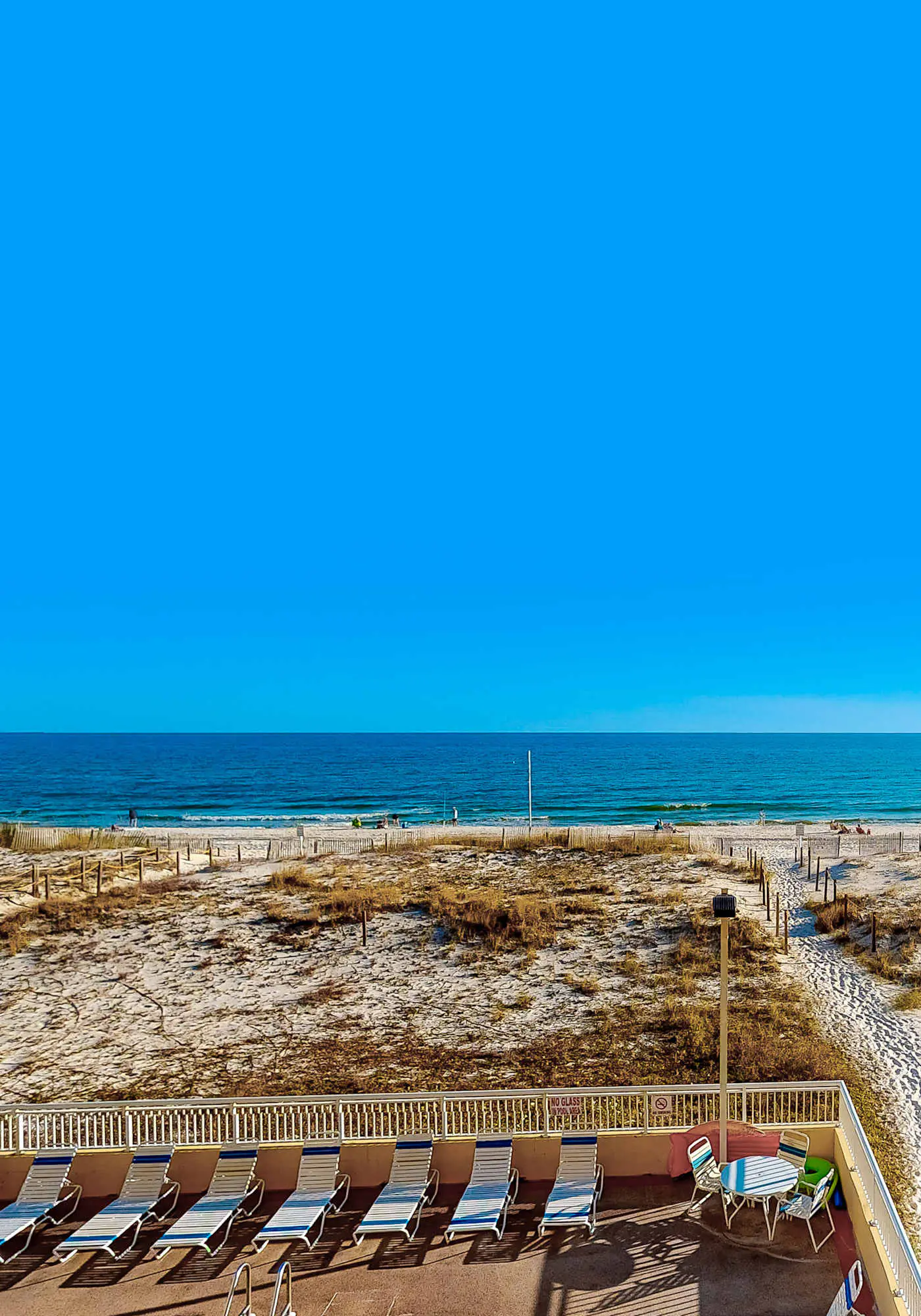 Sunny gulf-front condo with private balcony, shared outdoor pool, great views