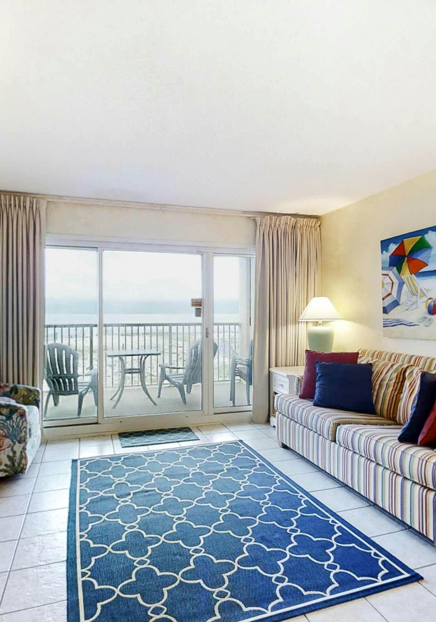 Sunny gulf-front condo with private balcony, shared outdoor pool, great views