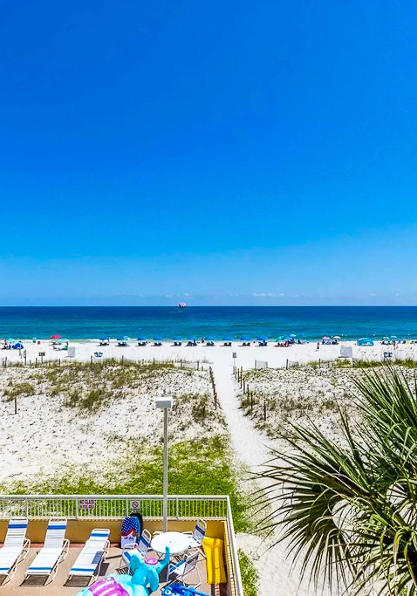 Sunny gulf-front condo with private balcony, shared outdoor pool, great views