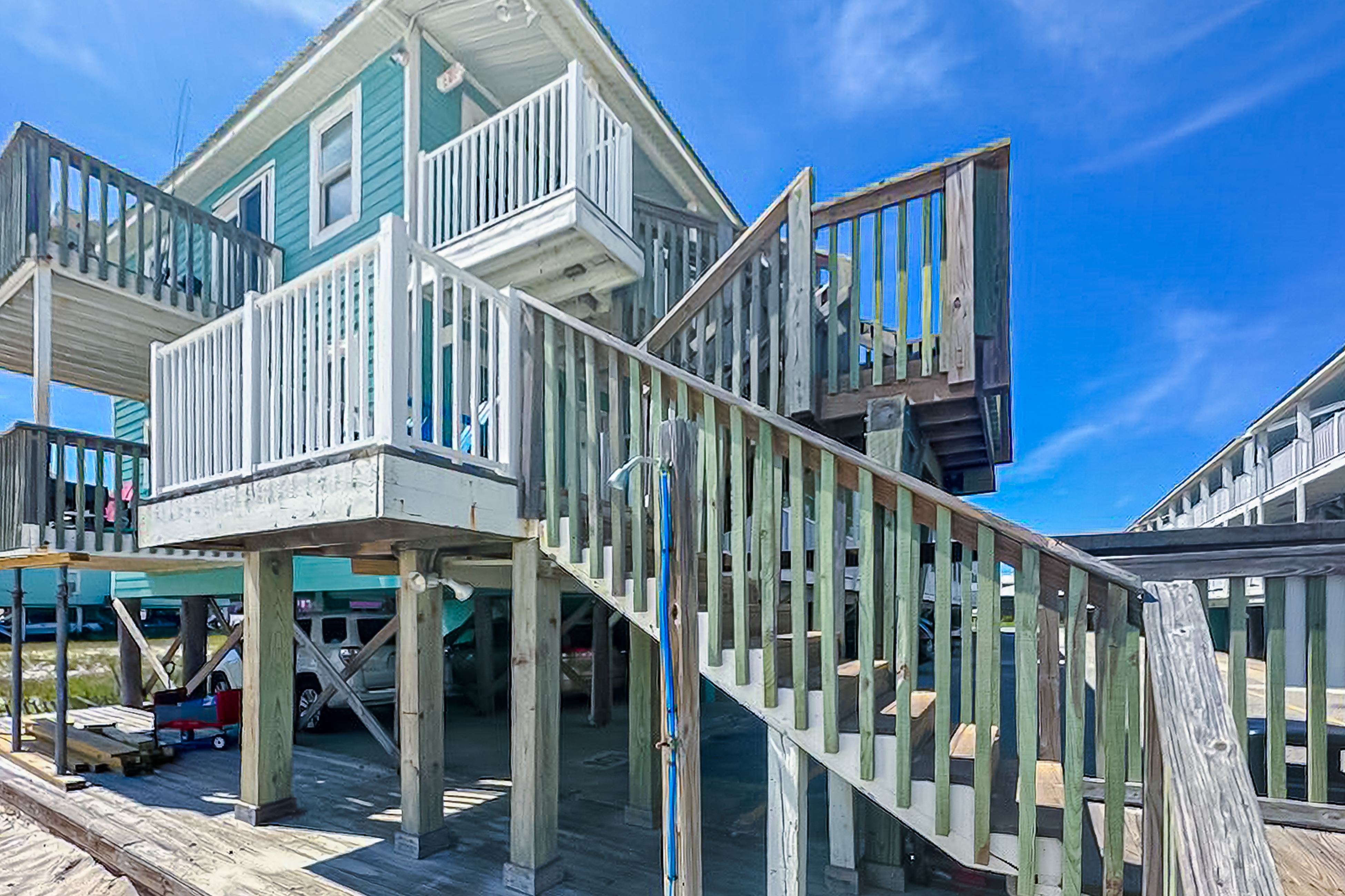 Beachfront condo with shared pool, outdoor shower, and beach access