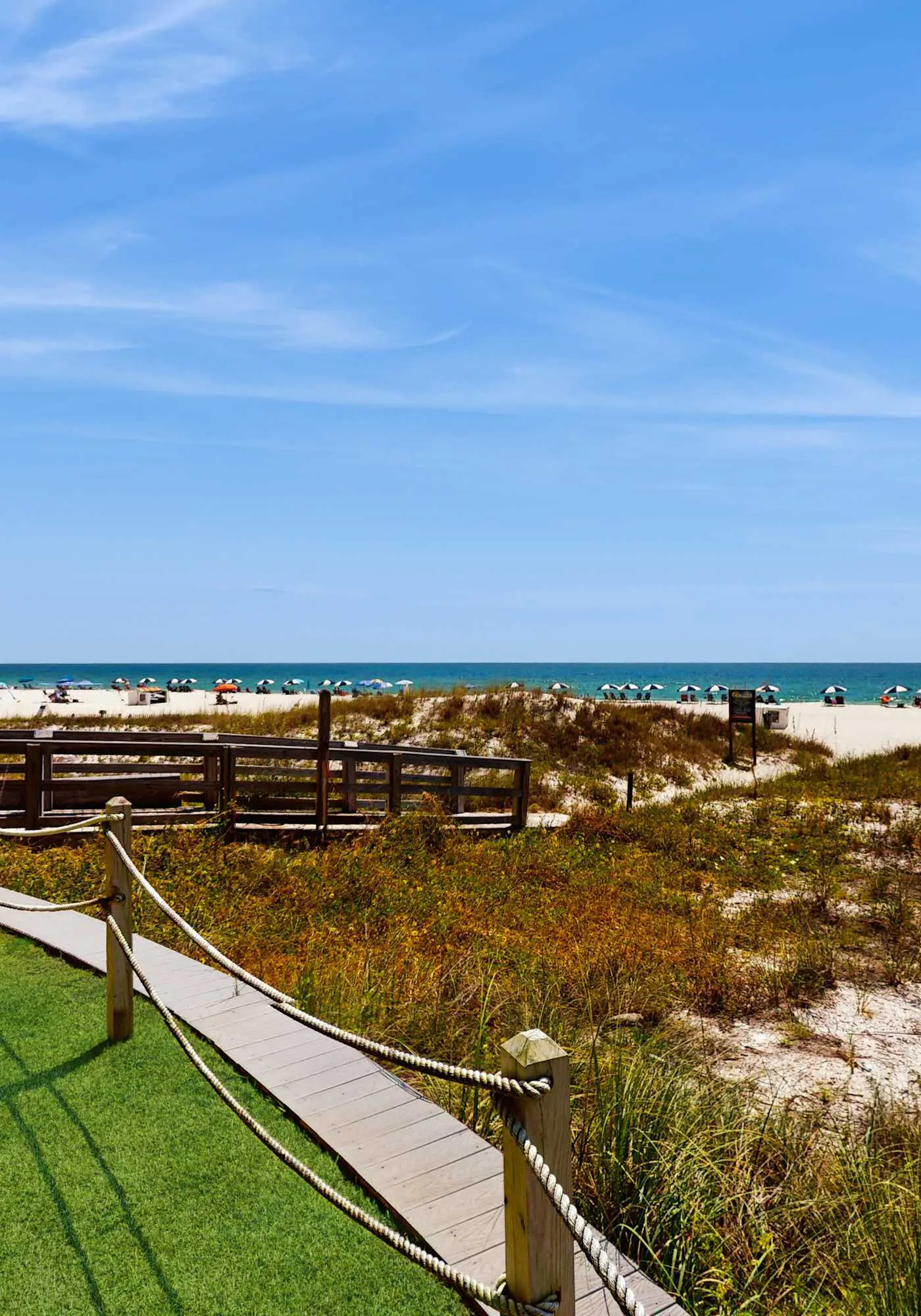 Elegant beachfront condo with wraparound balcony, Gulf views & pools