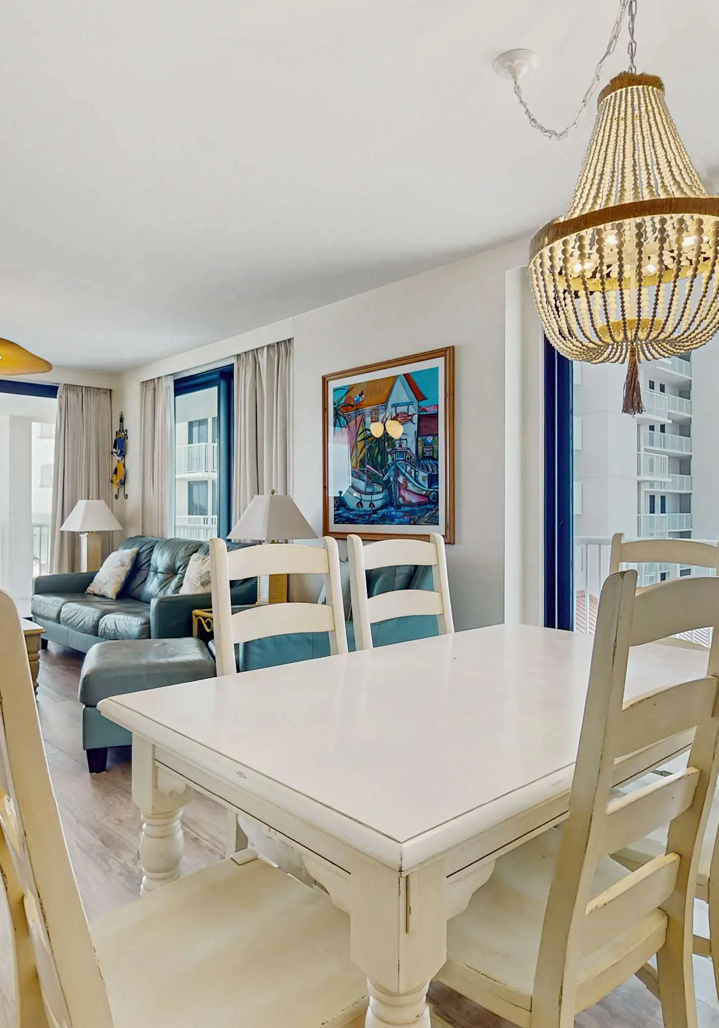 Elegant beachfront condo with wraparound balcony, Gulf views & pools