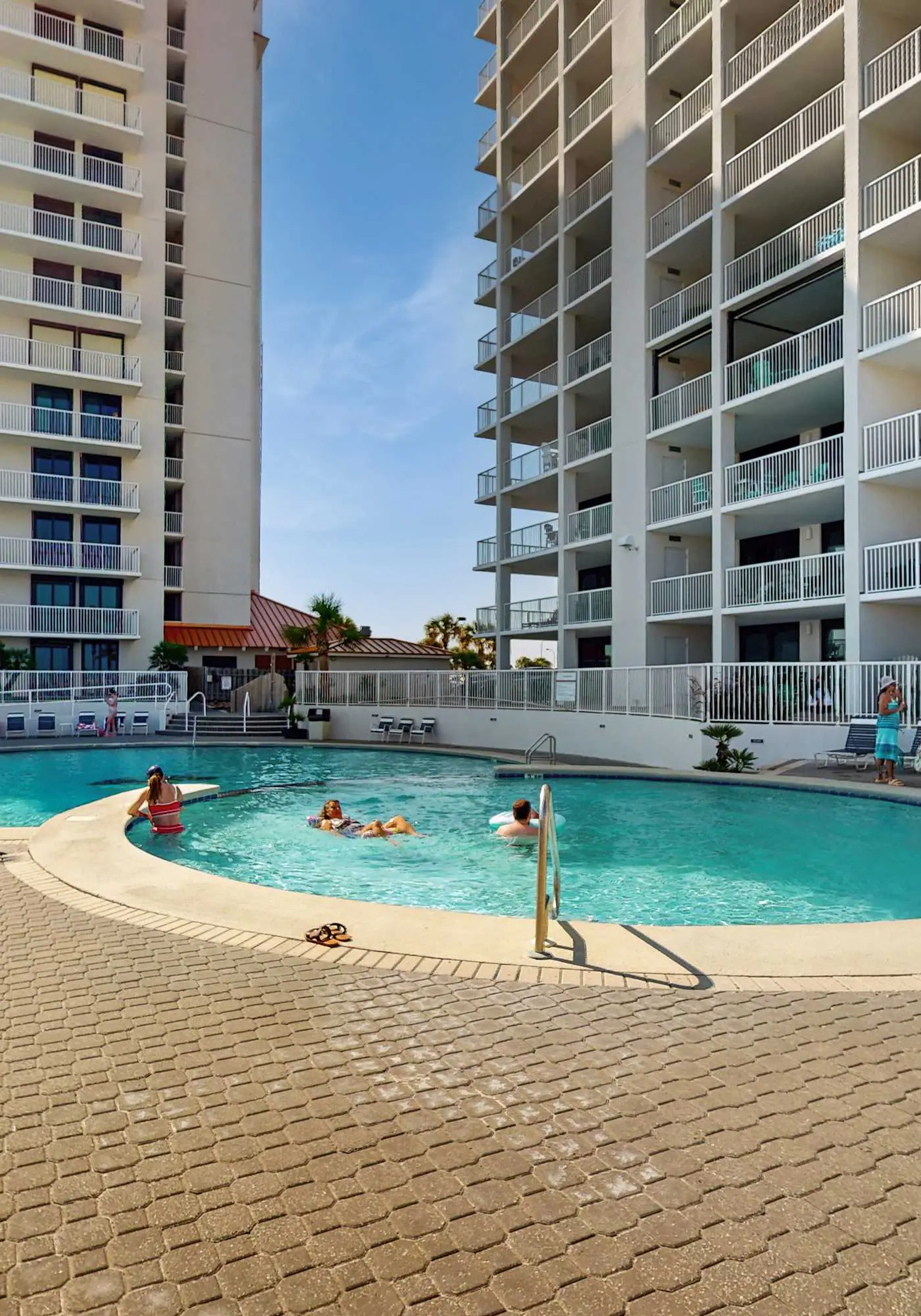 Elegant beachfront condo with wraparound balcony, Gulf views & pools