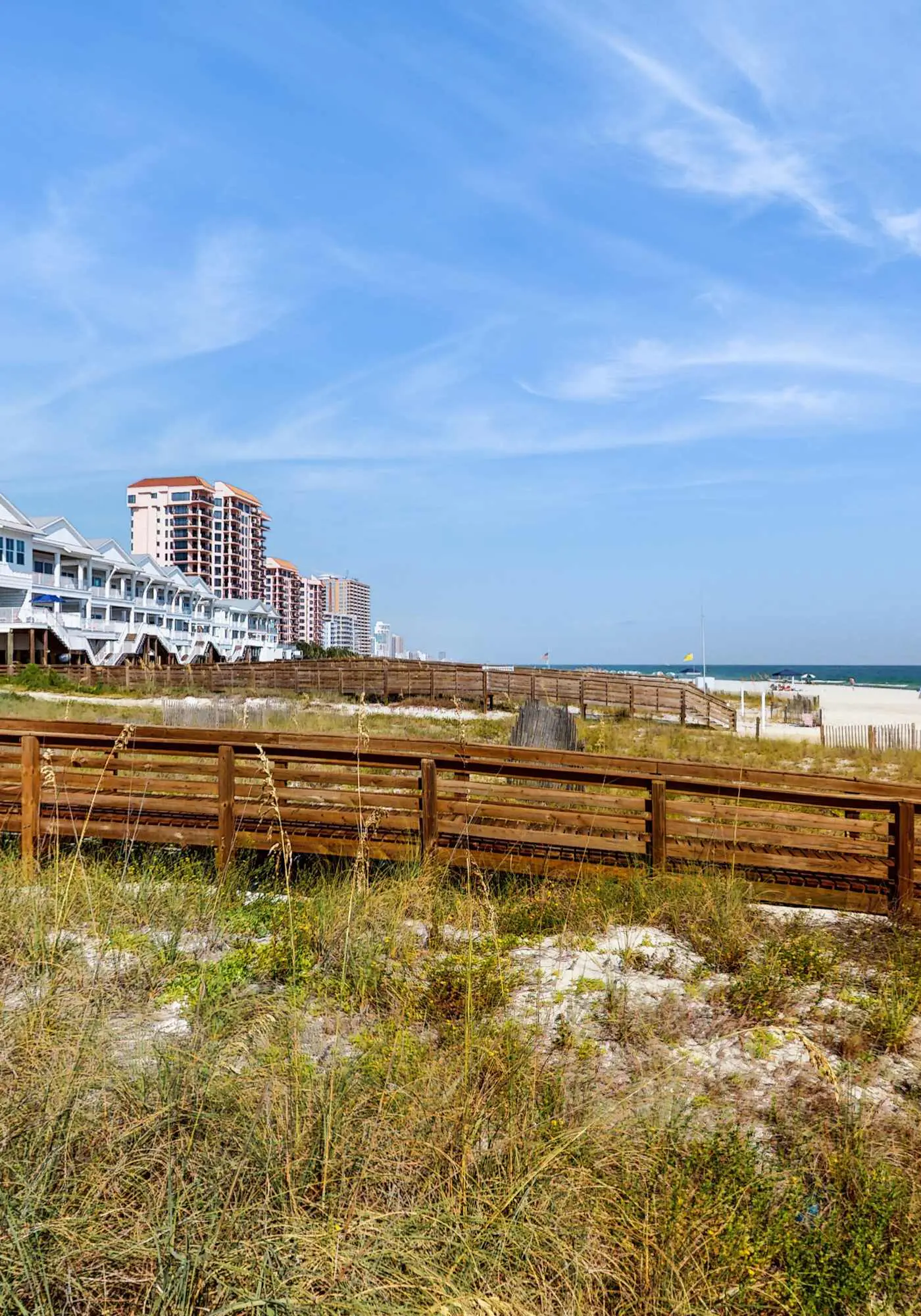Elegant beachfront condo with wraparound balcony, Gulf views & pools