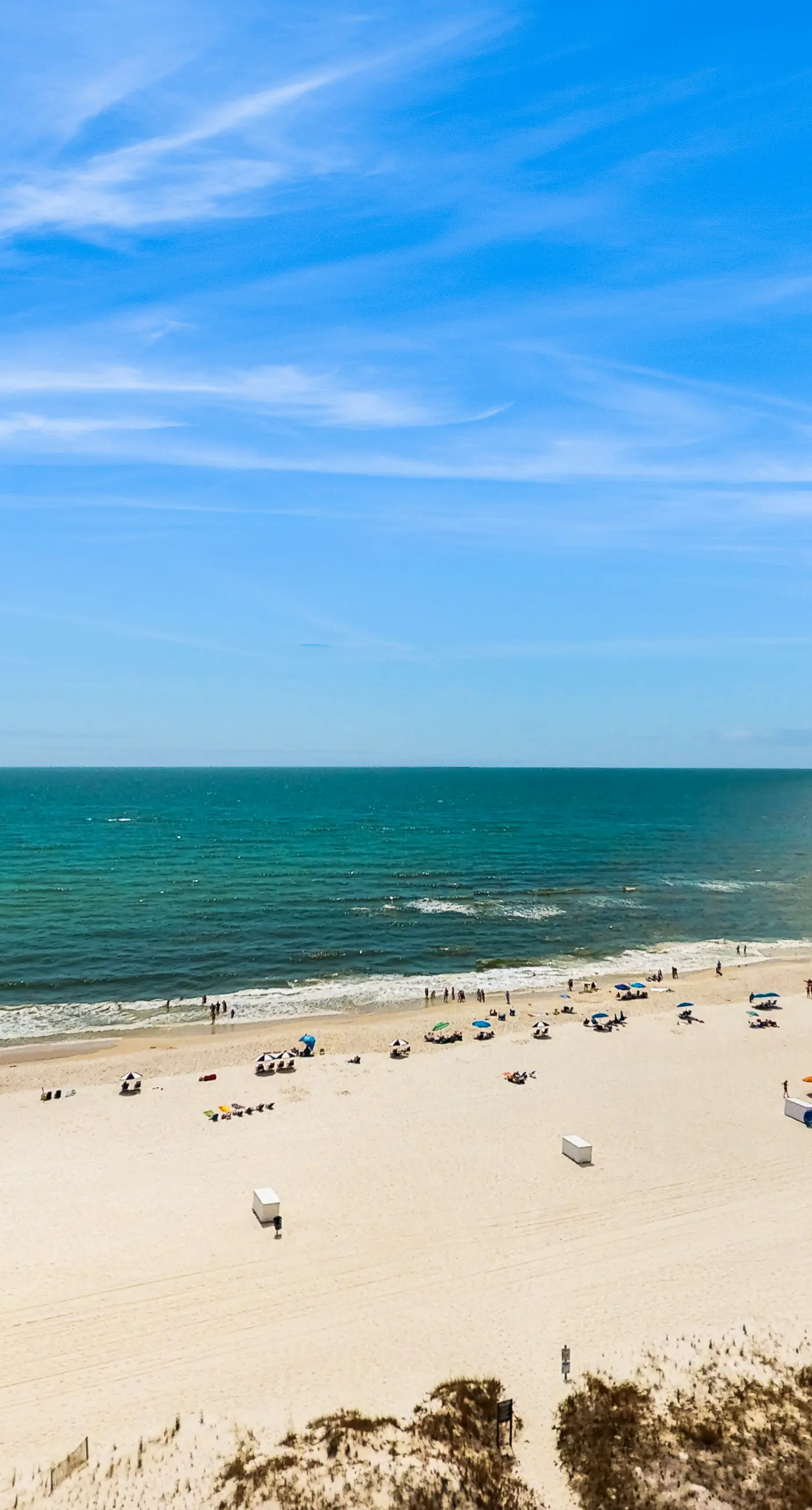 High-rise, Gulf-front condo with a balcony, pools, gym & tennis