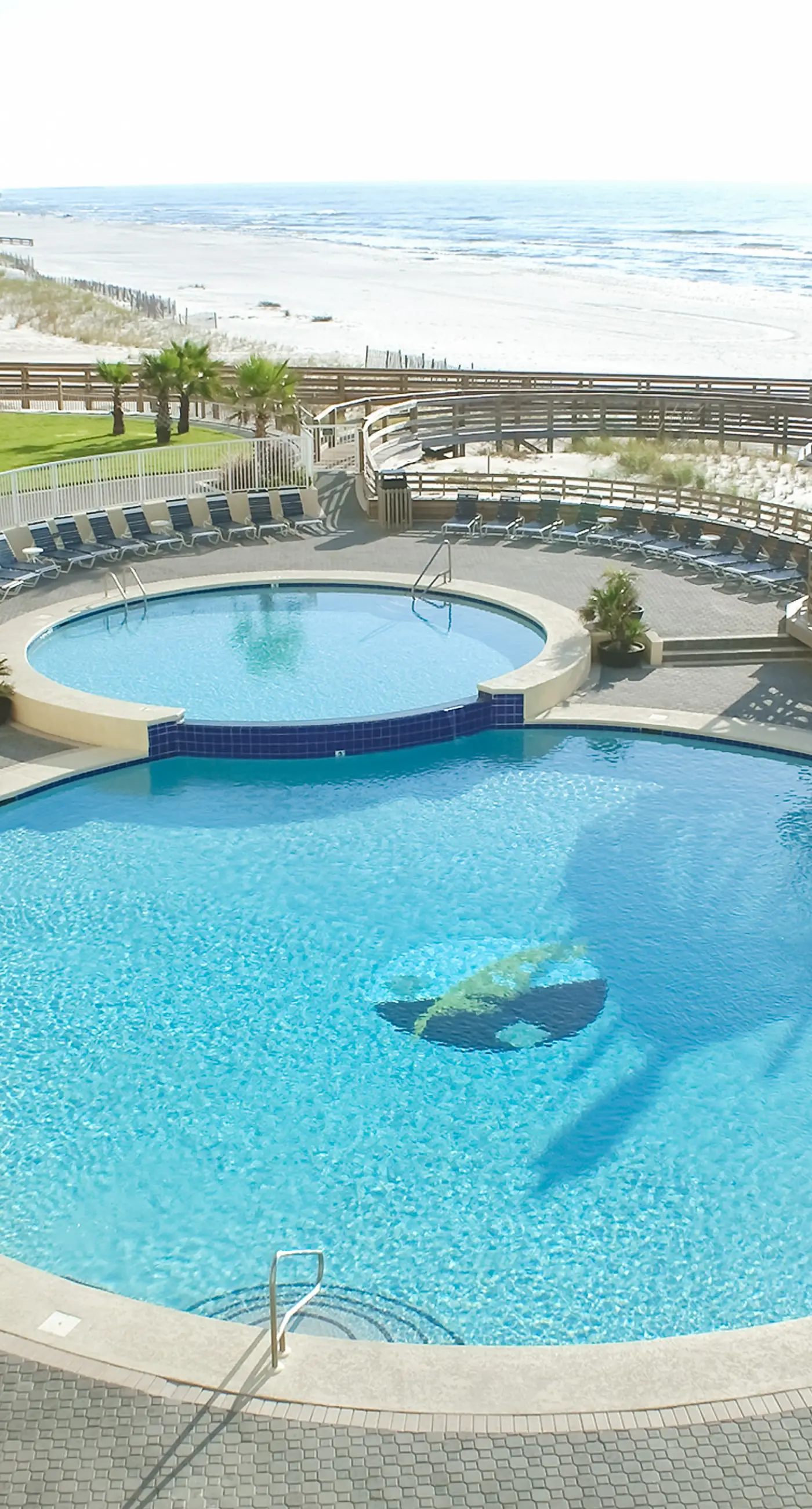 Gulf-front condo with balcony, hot tub & pools - snowbird-friendly