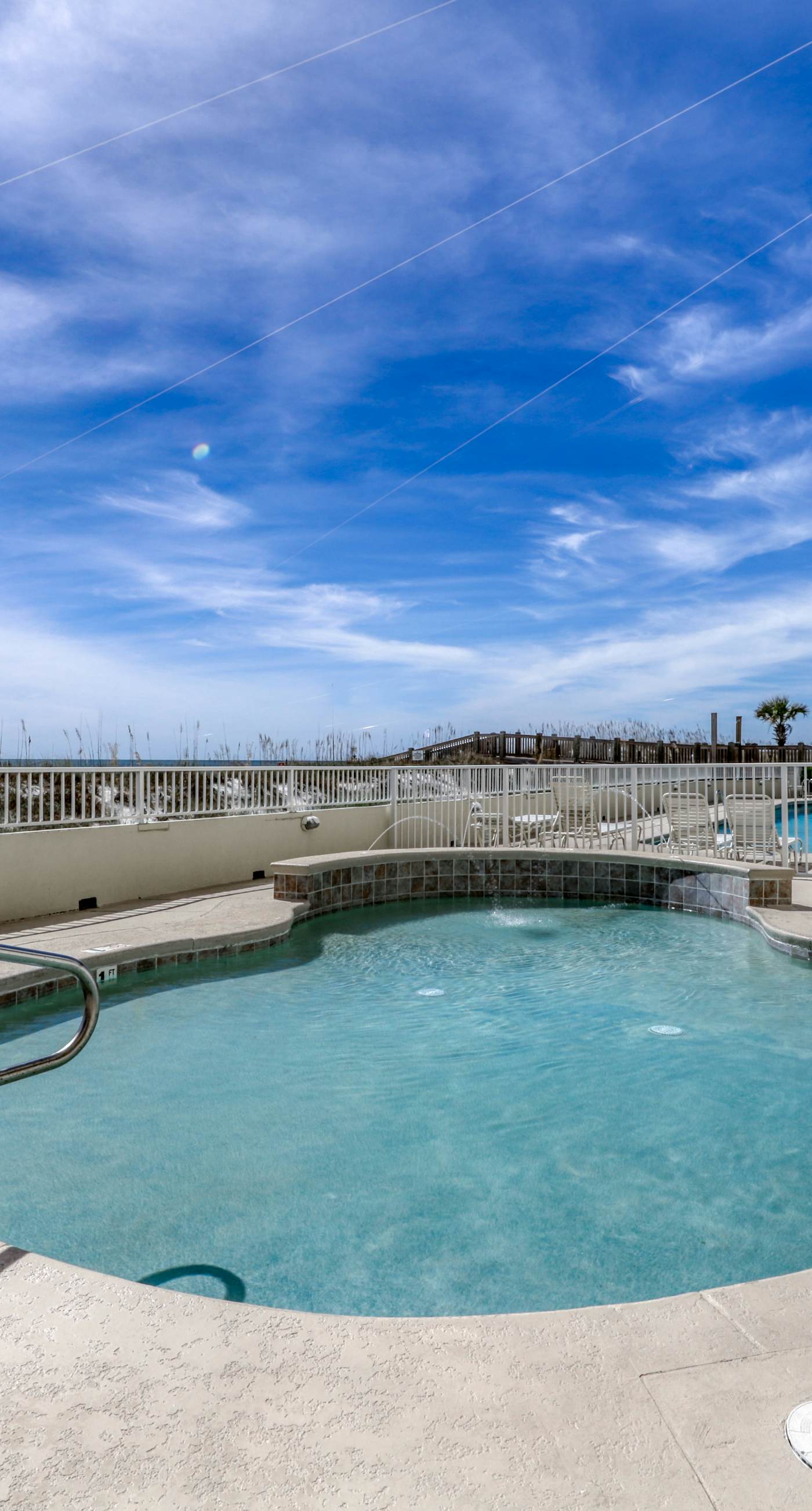 Waterfront condo w/ a private balcony, community pools, & fitness center