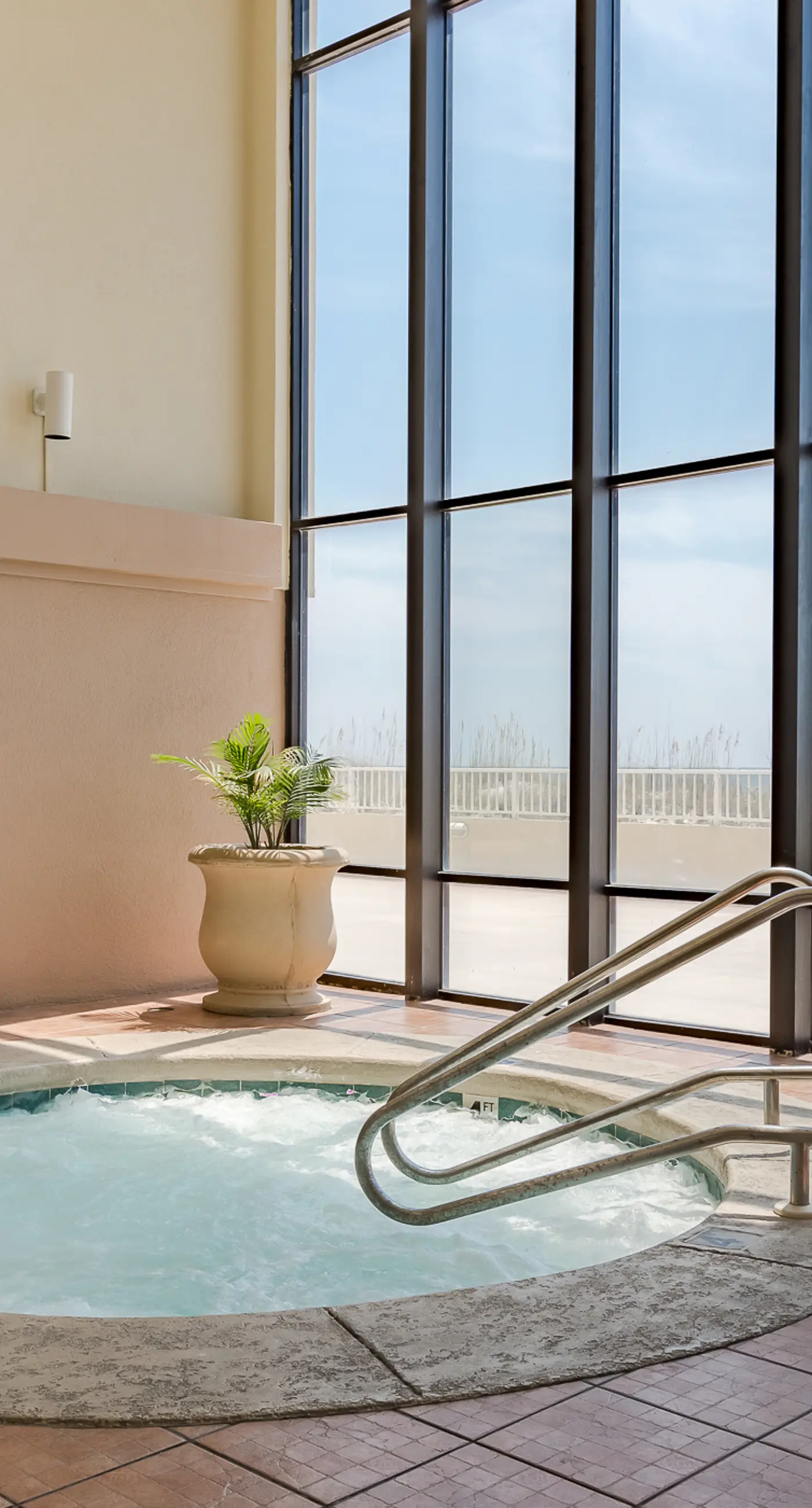 Beachfront condo w/ private, corner balcony, community pools, & a grilling area
