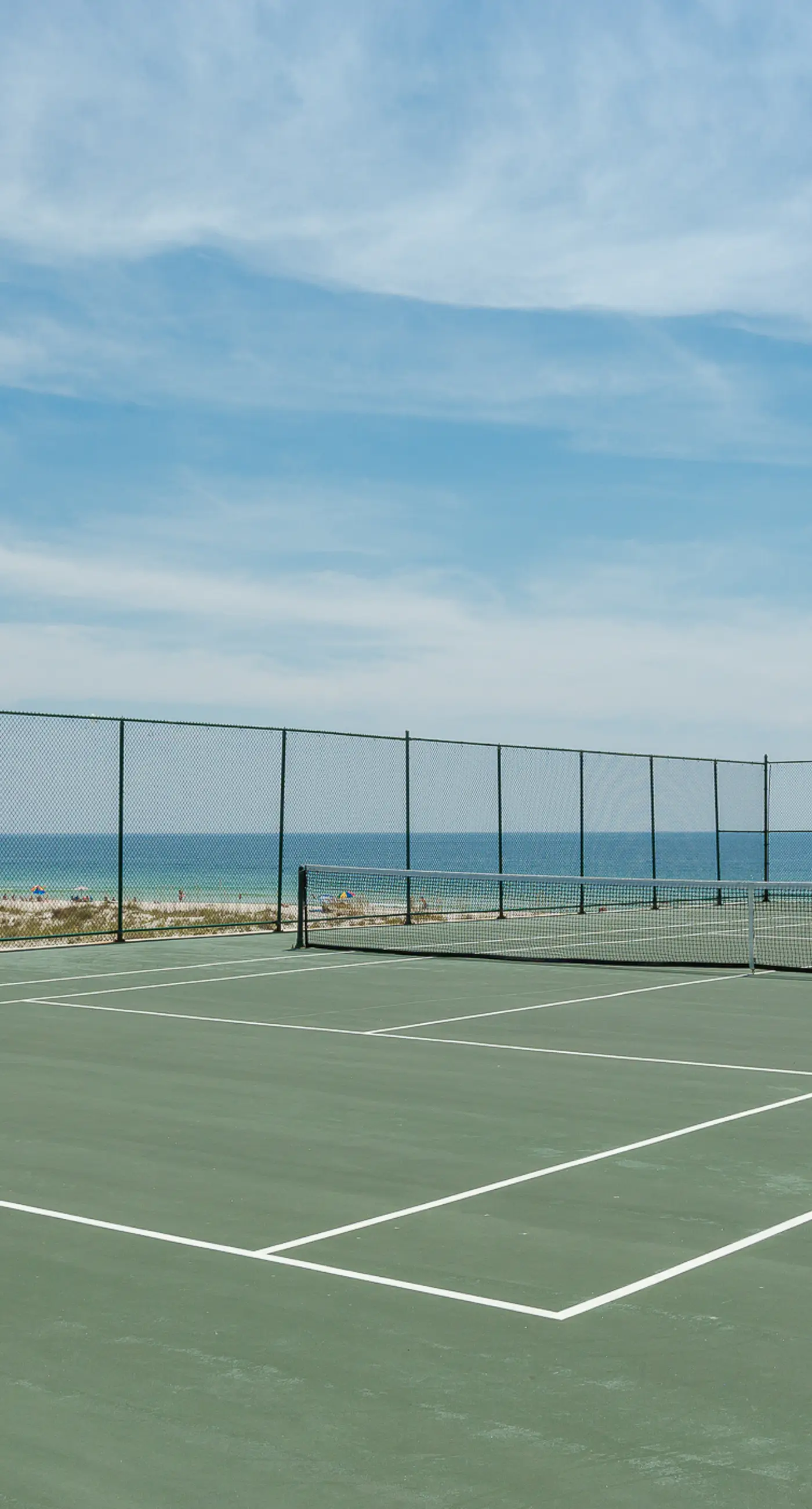 Beachfront condo w/ private, corner balcony, community pools, & a grilling area