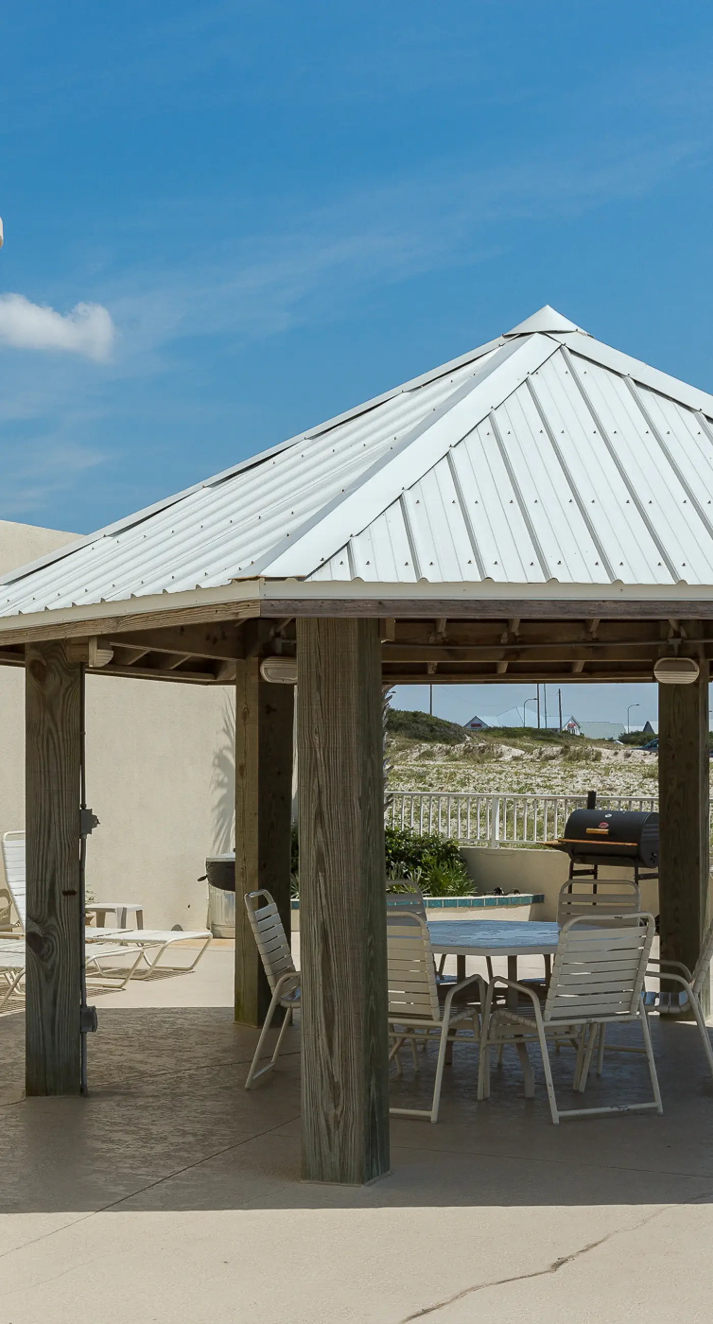 Beachfront condo w/ private, corner balcony, community pools, & a grilling area