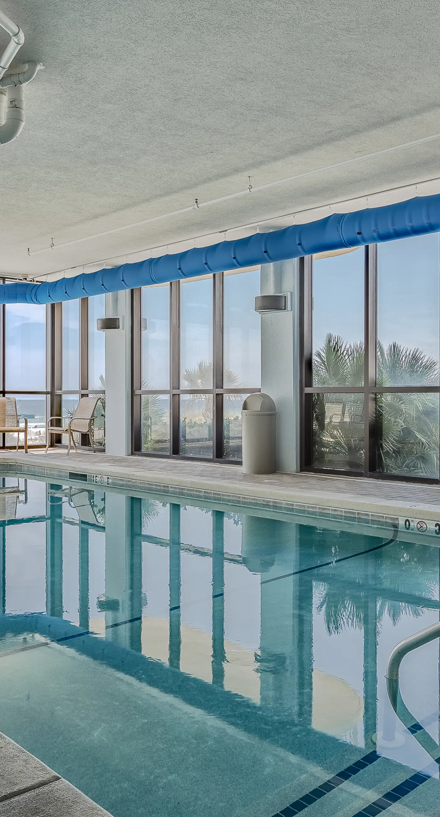 Beachfront condo w/ private, corner balcony, community pools, & a grilling area