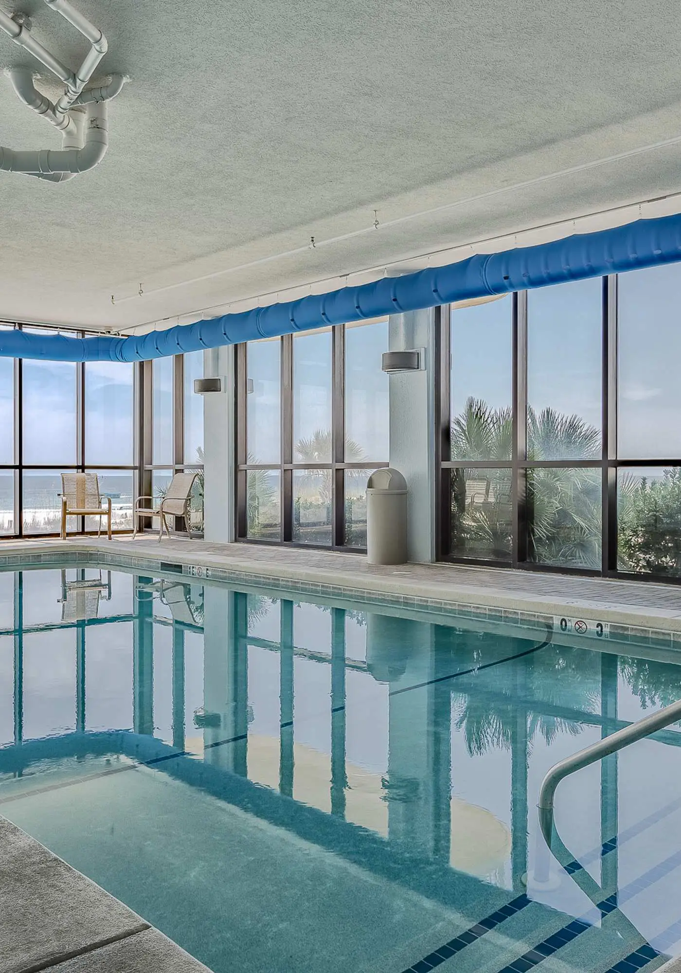 Beachfront condo w/ private, corner balcony, community pools, & a grilling area