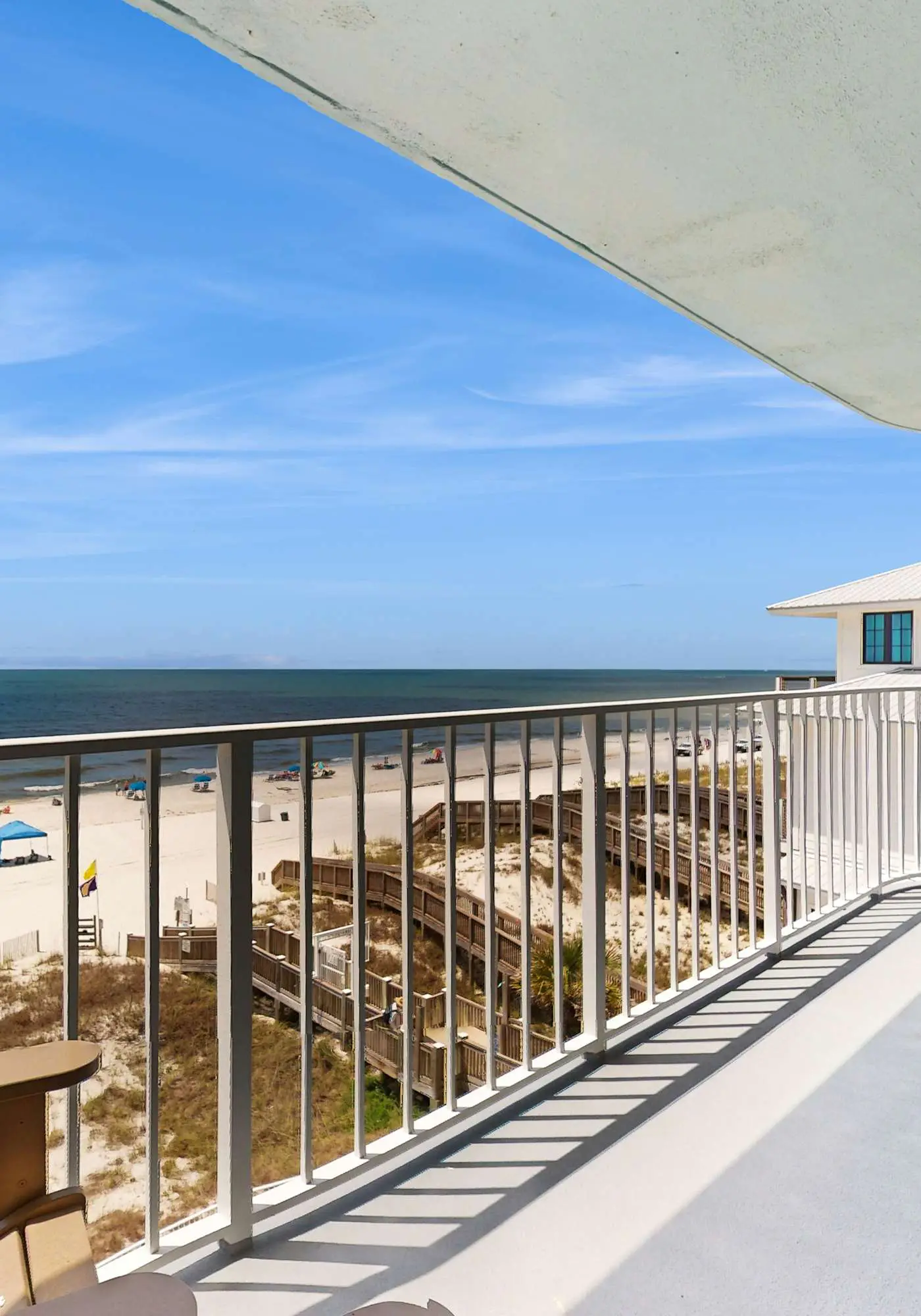 Beachfront condo w/ private, corner balcony, community pools, & a grilling area