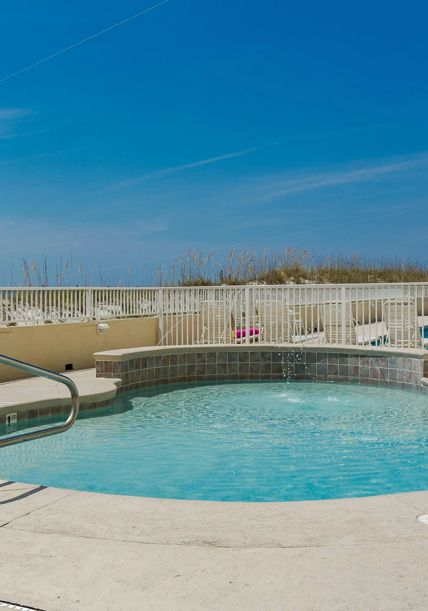 Beachfront condo w/ private, corner balcony, community pools, & a grilling area