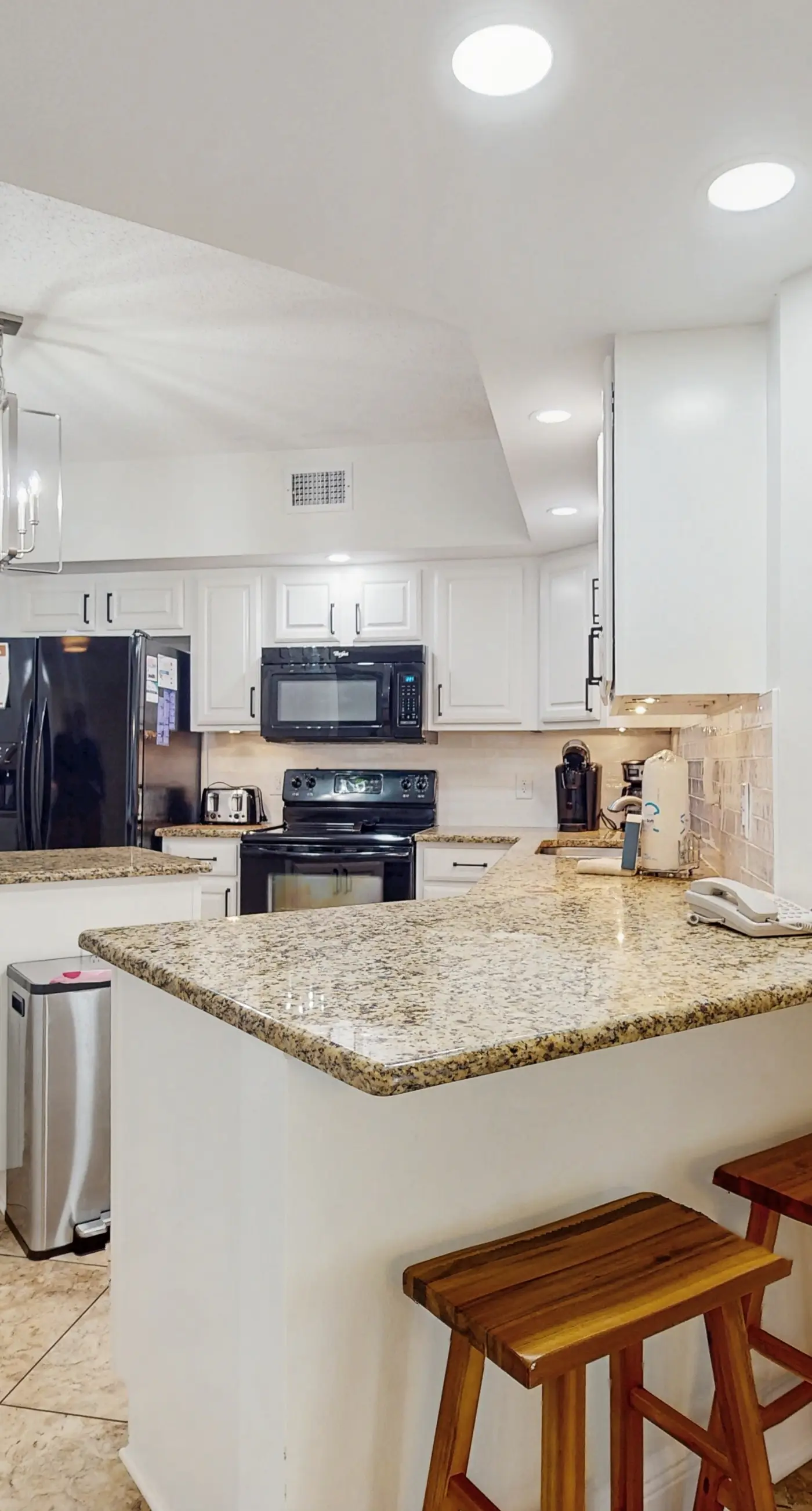 Gorgeous beachfront condo with open layout, pools, tennis, & gym