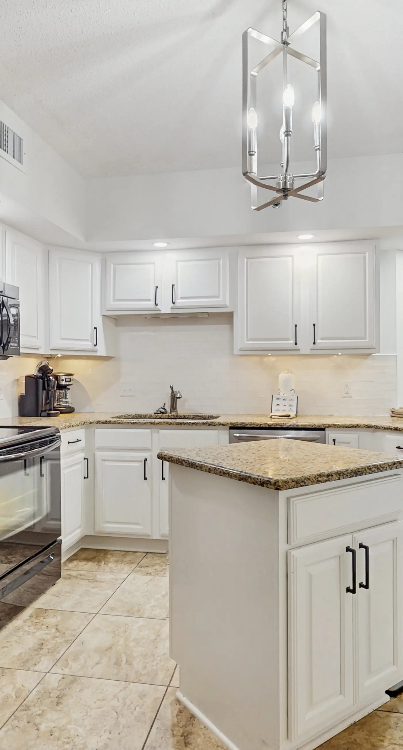 Gorgeous beachfront condo with open layout, pools, tennis, & gym