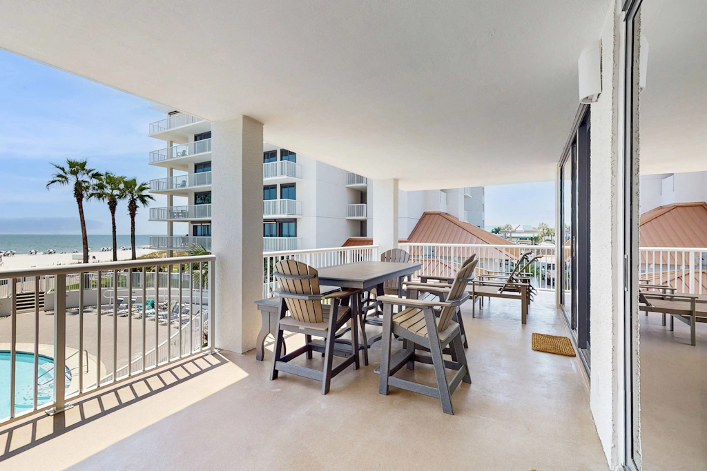 Gulf-front condo with furnished balcony, pools & hot tub