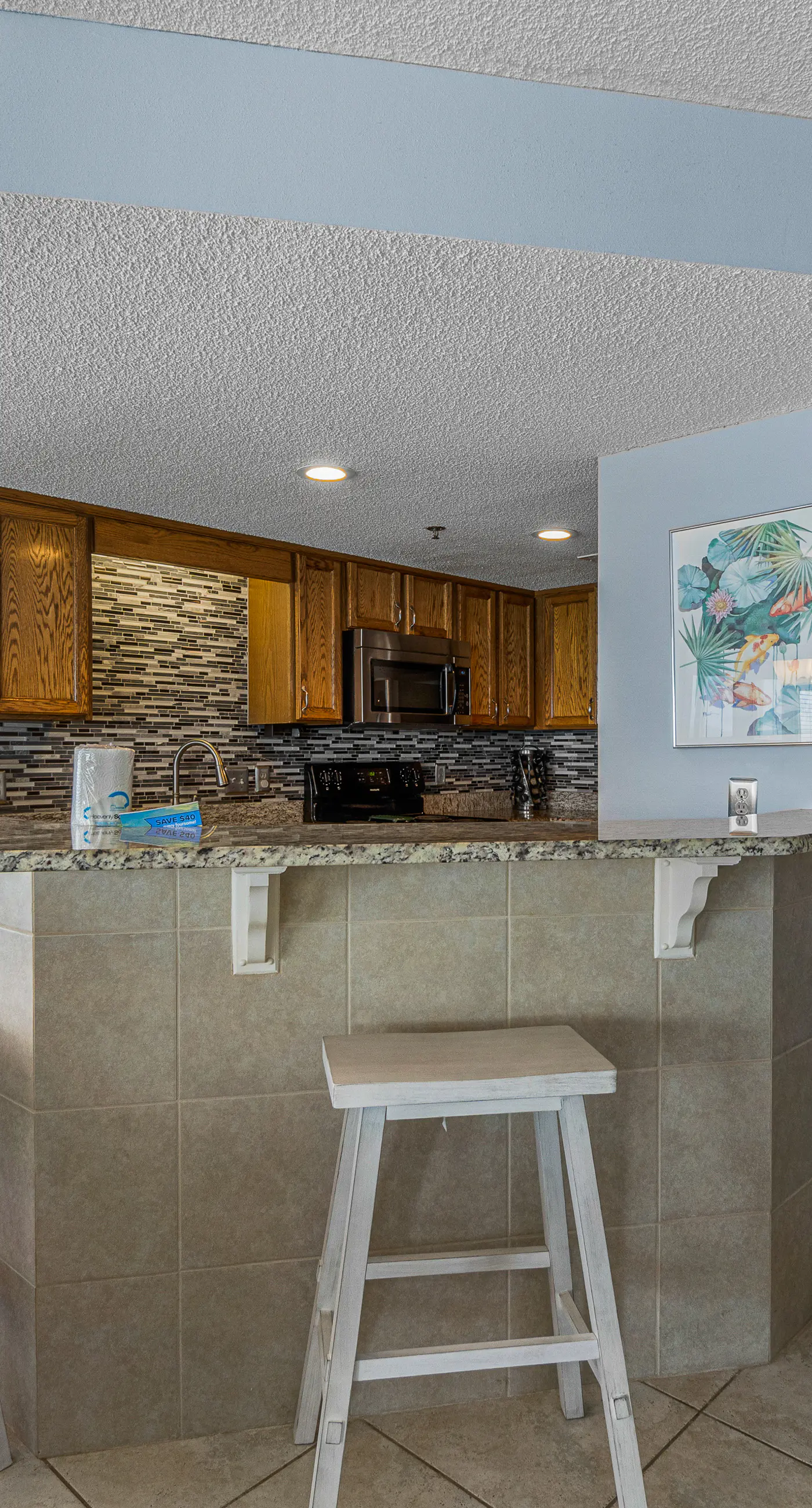 Stunning beachfront condo w/ a full kitchen, private balcony, & shared pools