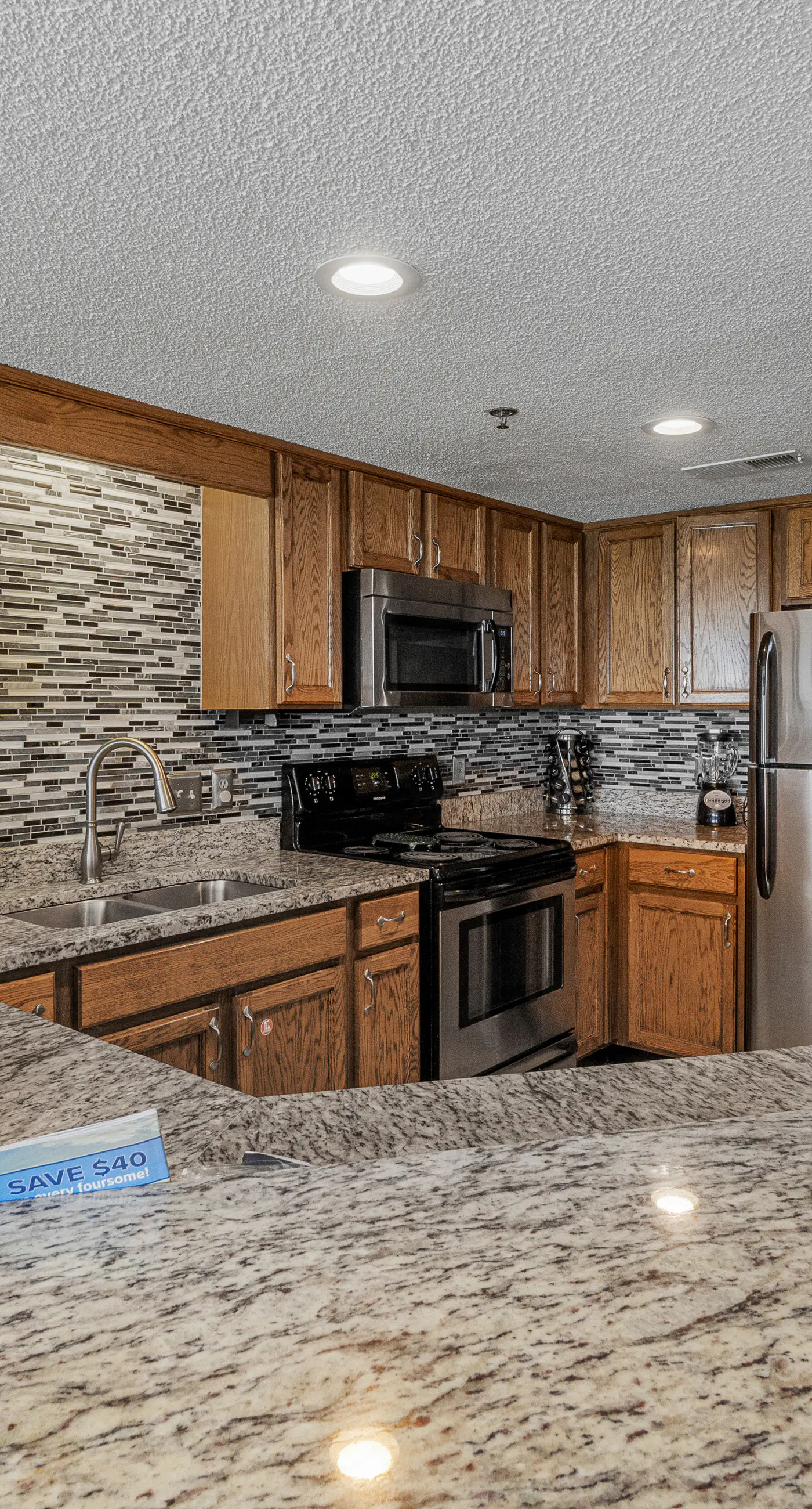 Stunning beachfront condo w/ a full kitchen, private balcony, & shared pools