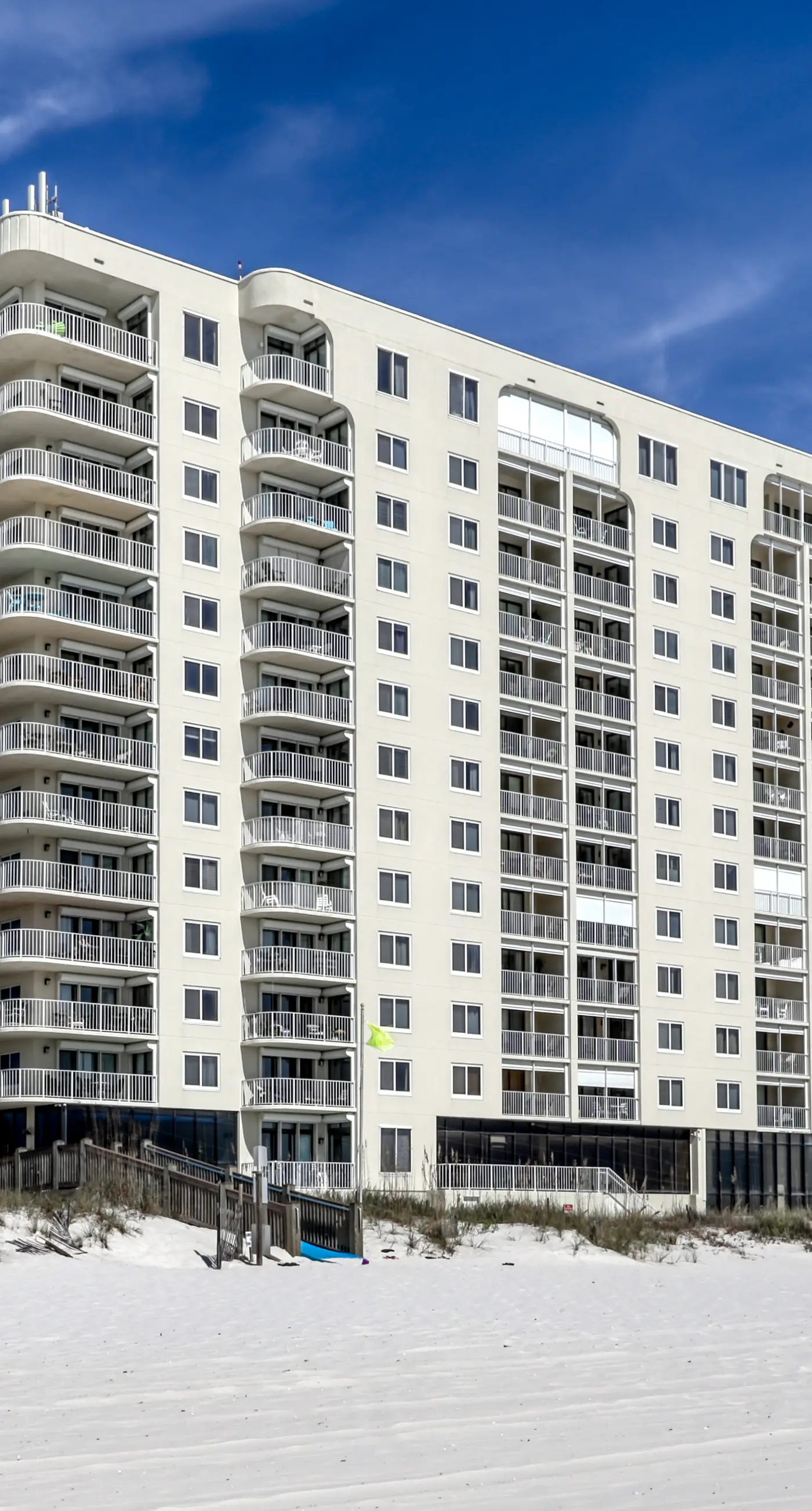 Stunning beachfront condo w/ a full kitchen, private balcony, & shared pools