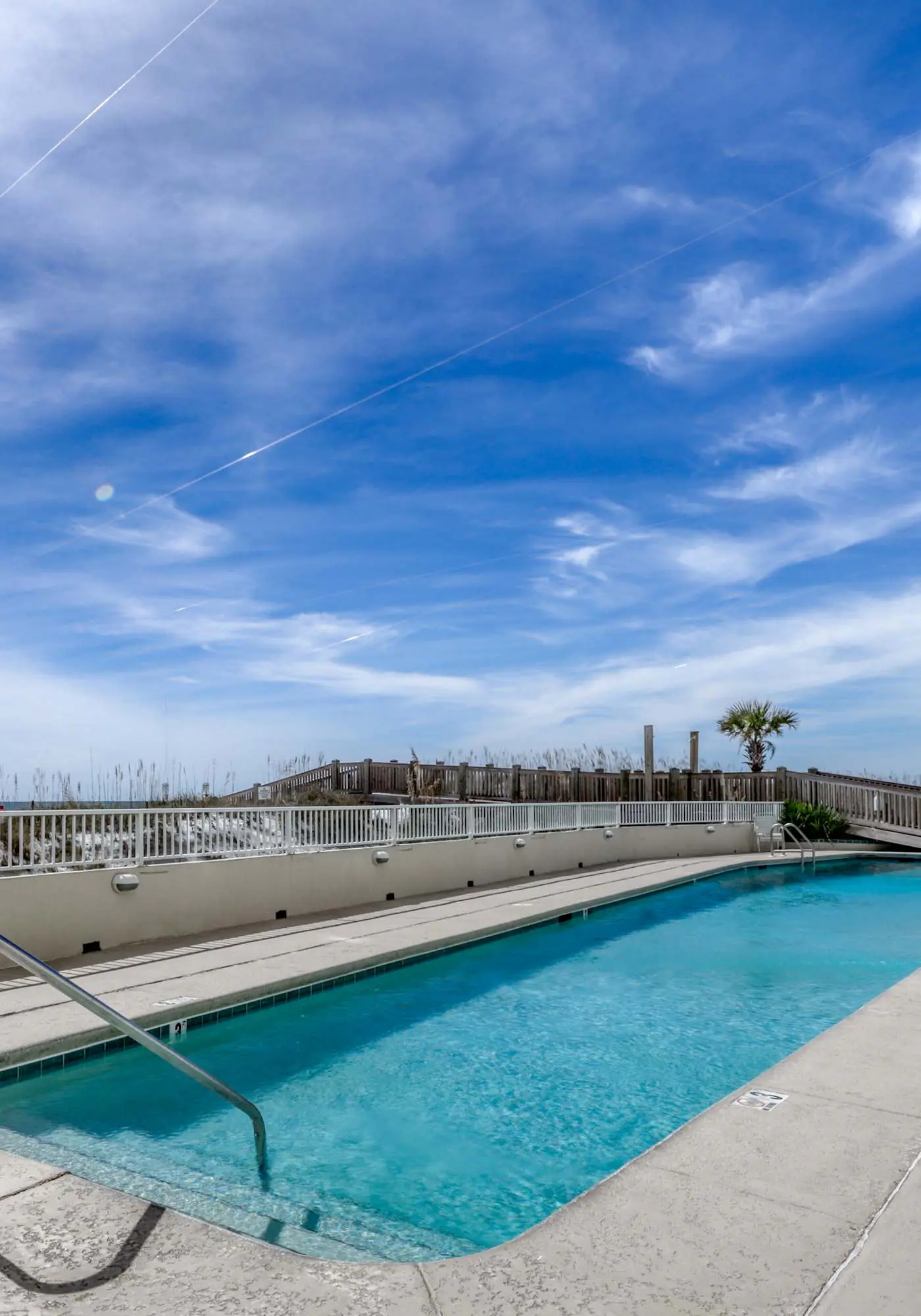 Stunning beachfront condo w/ a full kitchen, private balcony, & shared pools