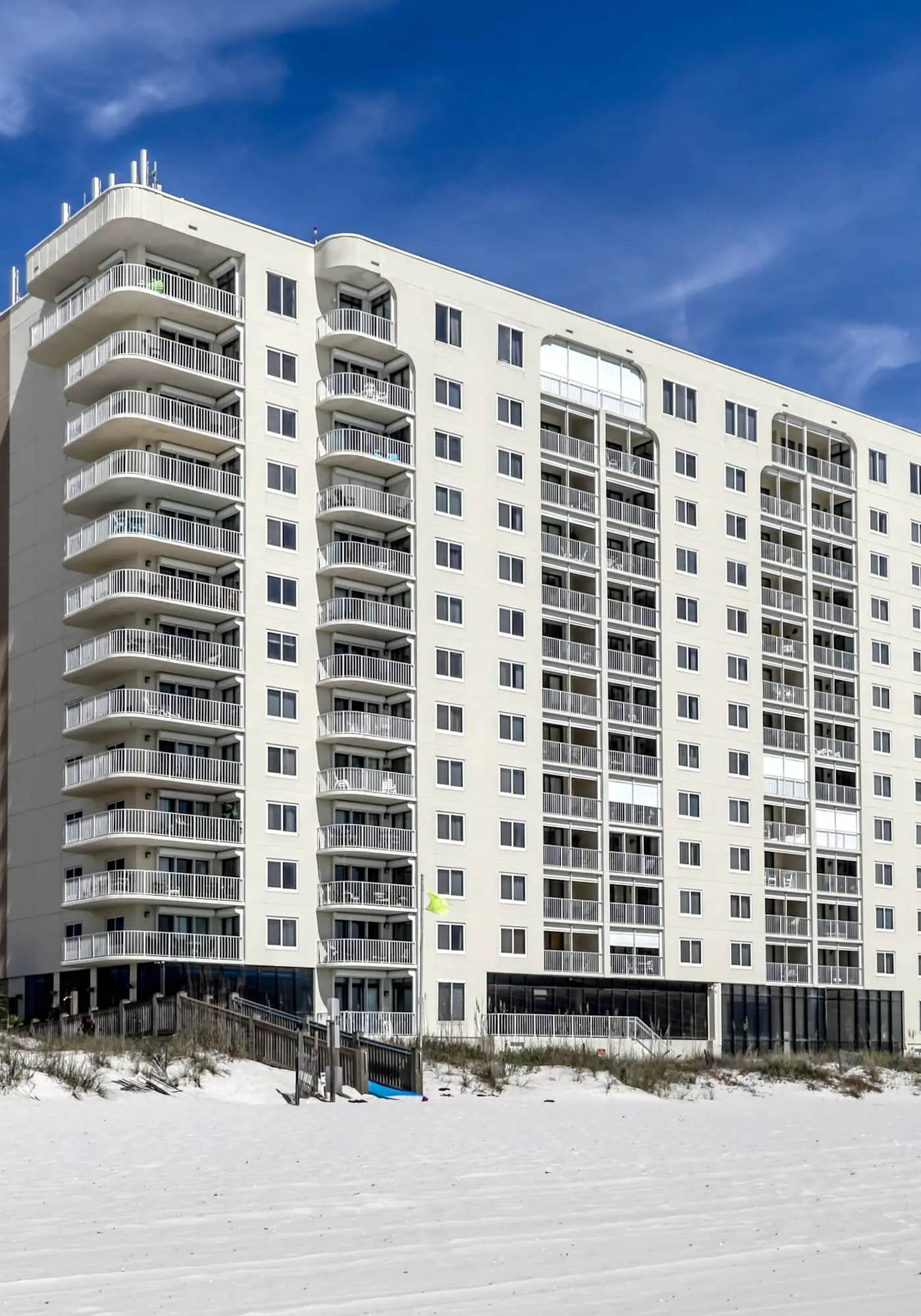 Stunning beachfront condo w/ a full kitchen, private balcony, & shared pools