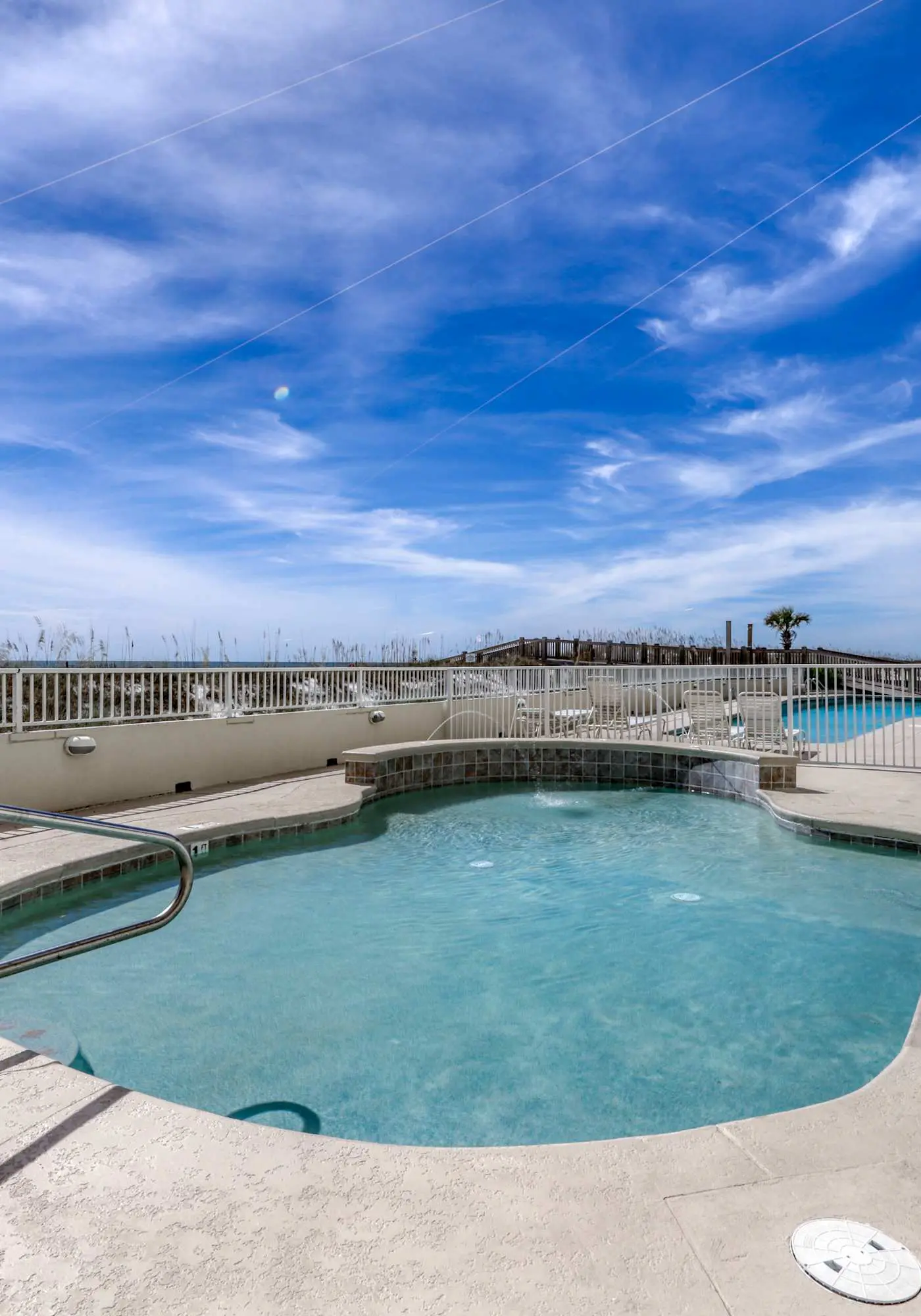 Stunning beachfront condo w/ a full kitchen, private balcony, & shared pools