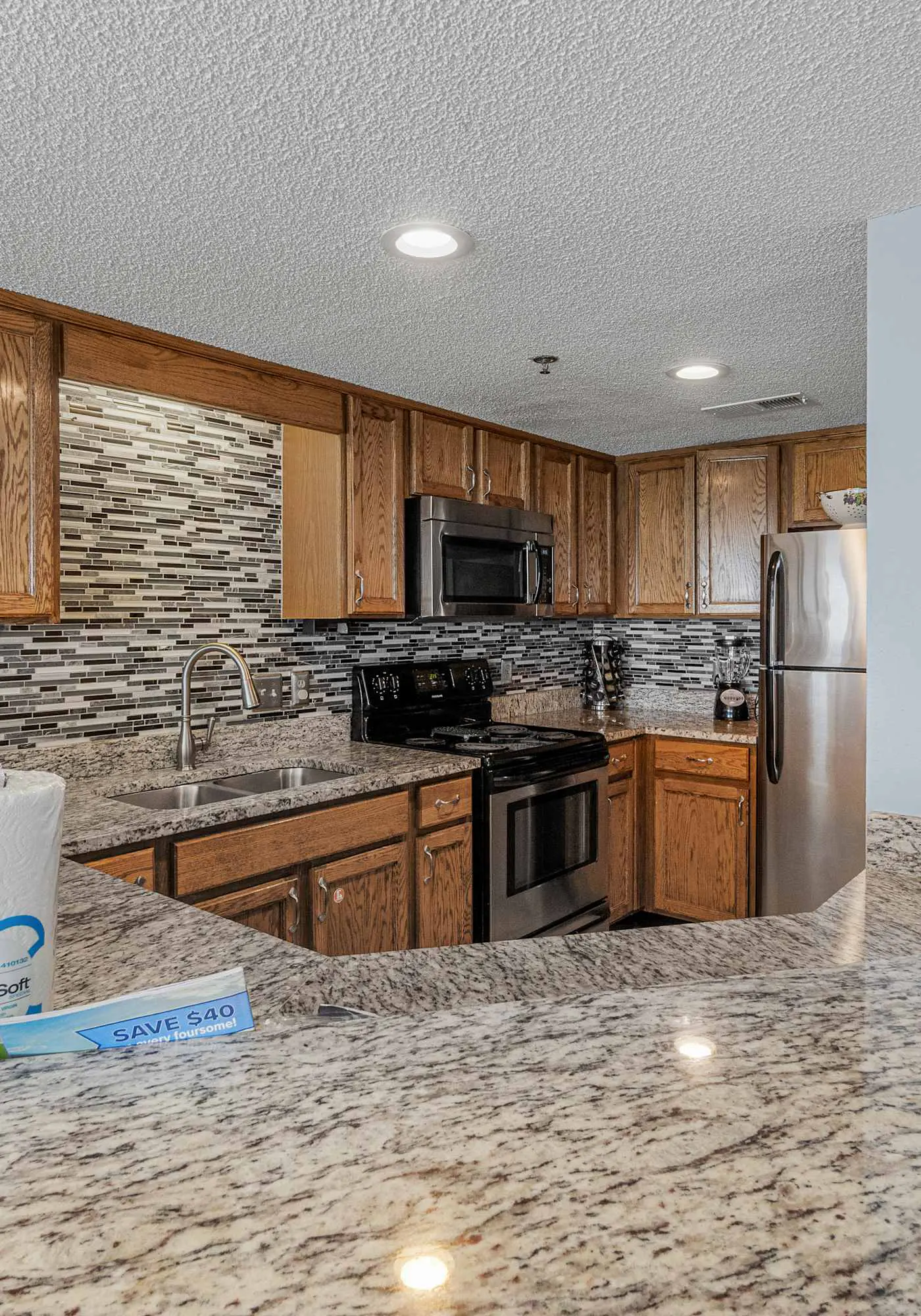 Stunning beachfront condo w/ a full kitchen, private balcony, & shared pools