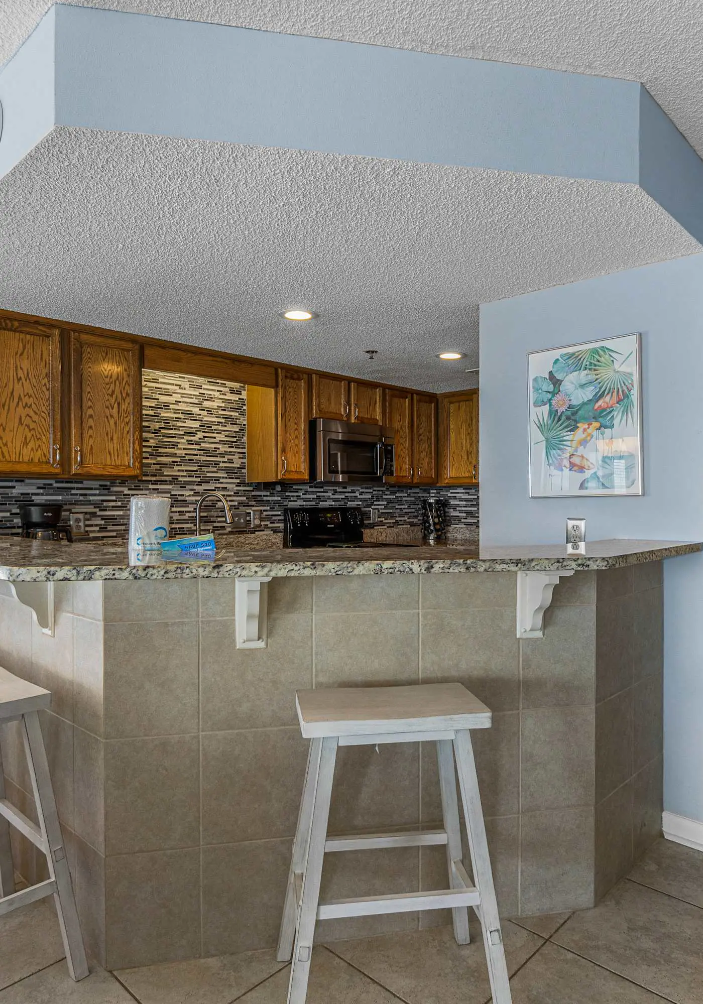 Stunning beachfront condo w/ a full kitchen, private balcony, & shared pools
