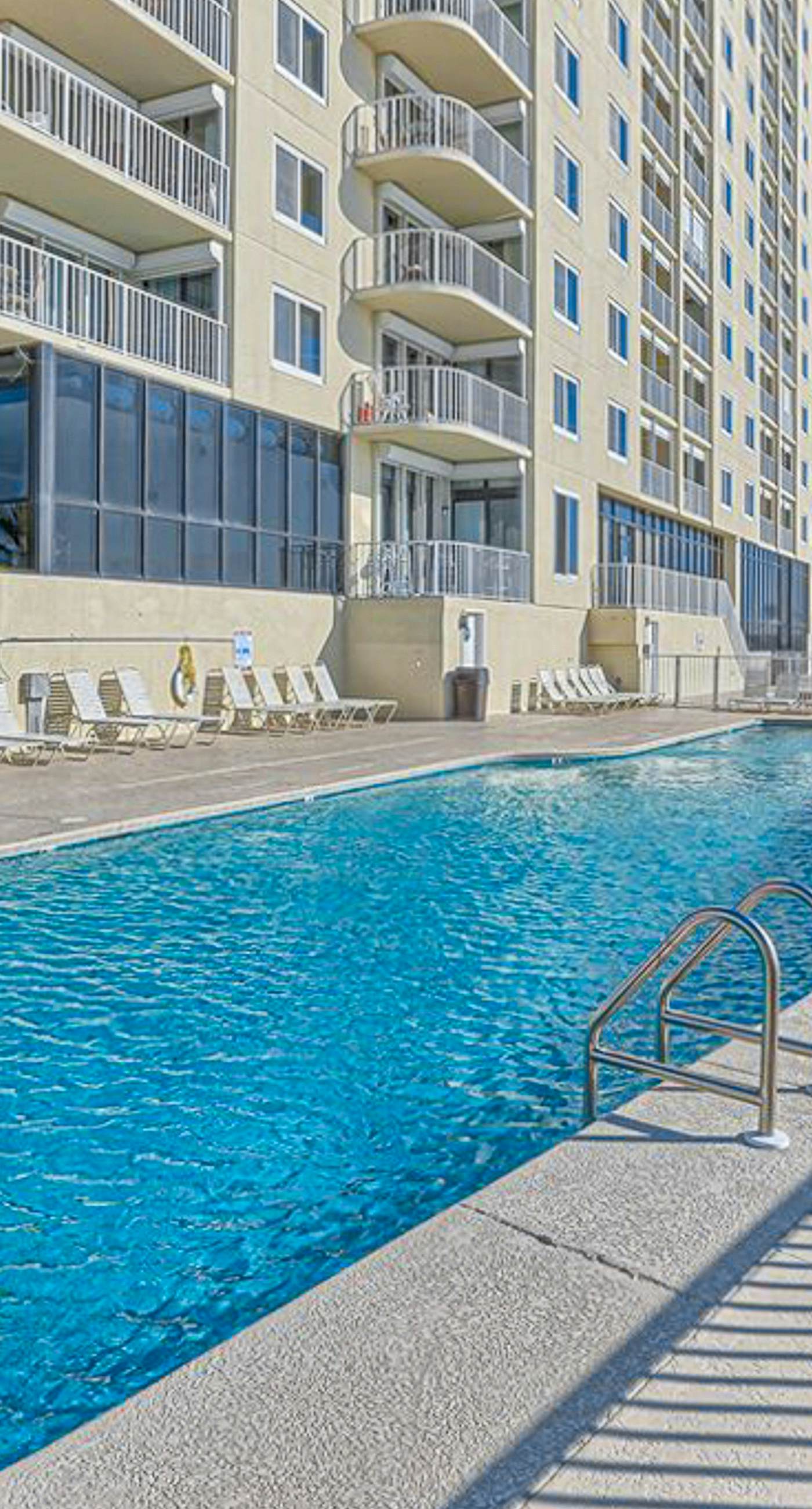 Beachfront condo with stunning views, pool, WiFi, and washer/dryer