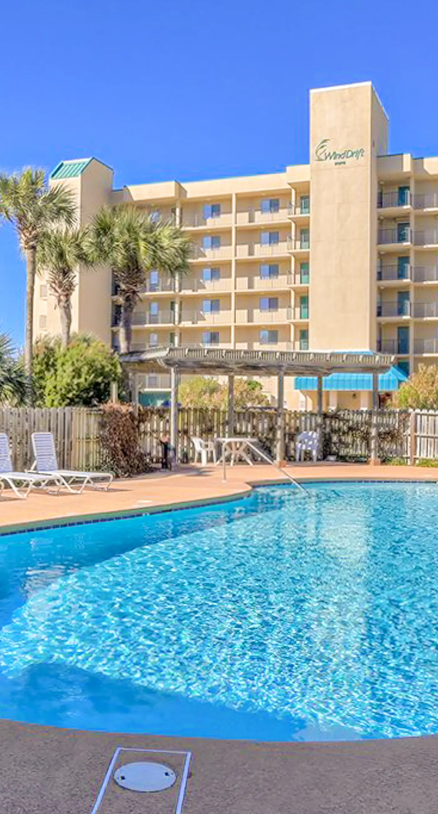 Beachfront condo with pool, private balcony, & washer and dryer!