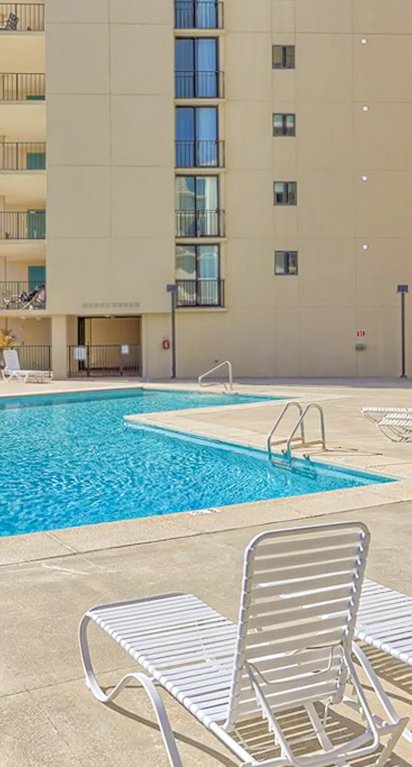 Beachfront condo with pool, private balcony, & washer and dryer!