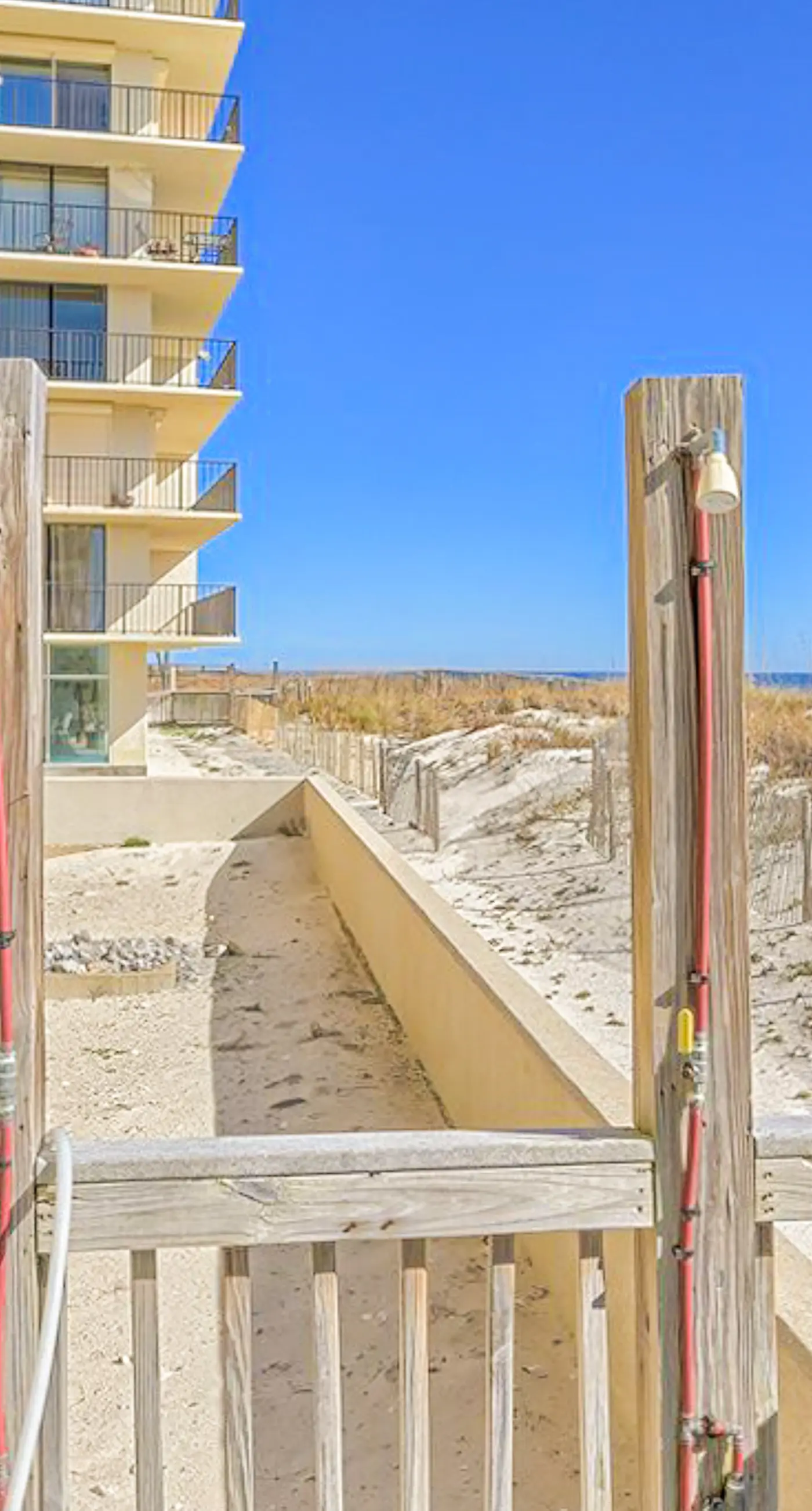 Beachfront condo with pool, private balcony, & washer and dryer!