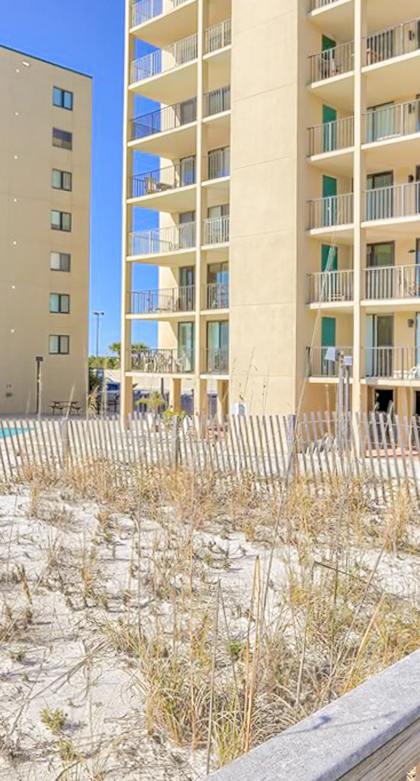Beachfront condo with pool, private balcony, & washer and dryer!