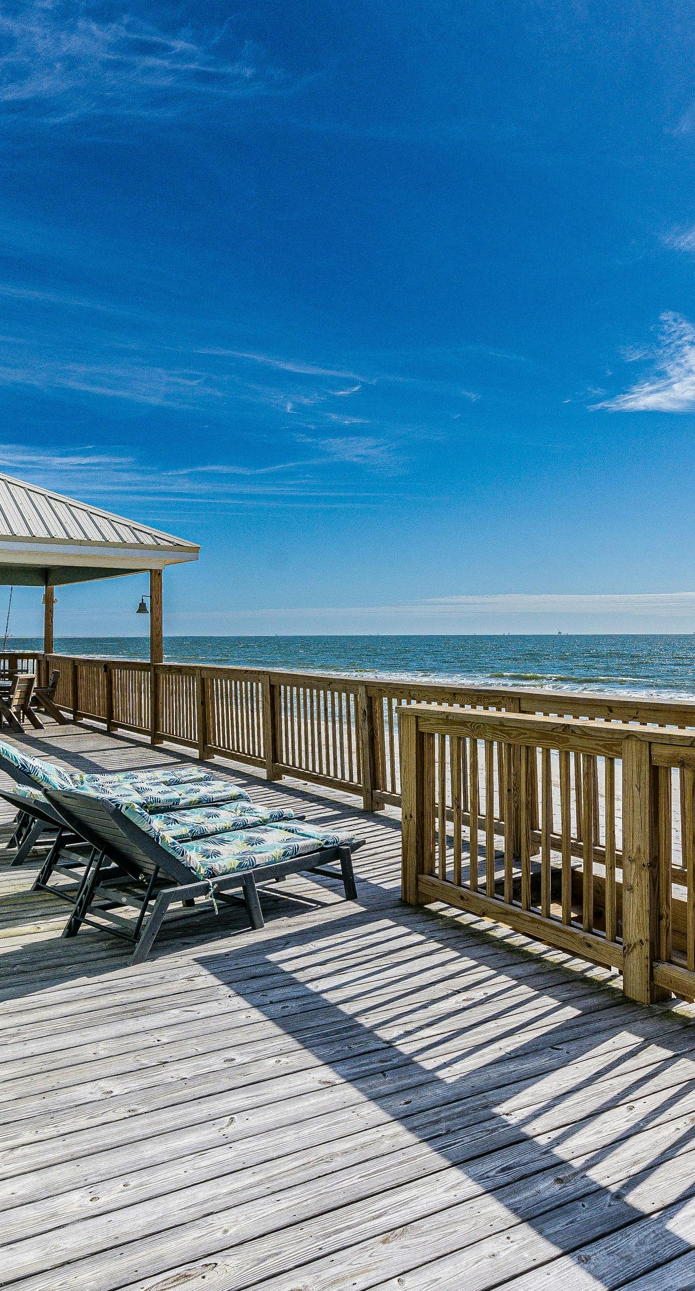 Waterfront home with wraparound deck, BBQ, spacious interior, & W/D