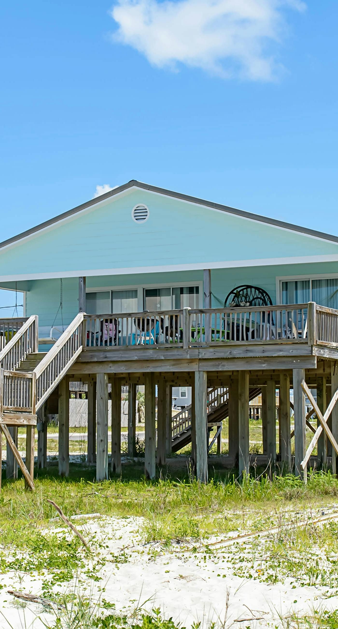 Welcoming home with WiFi, gulf views & spacious deck - steps to the beach